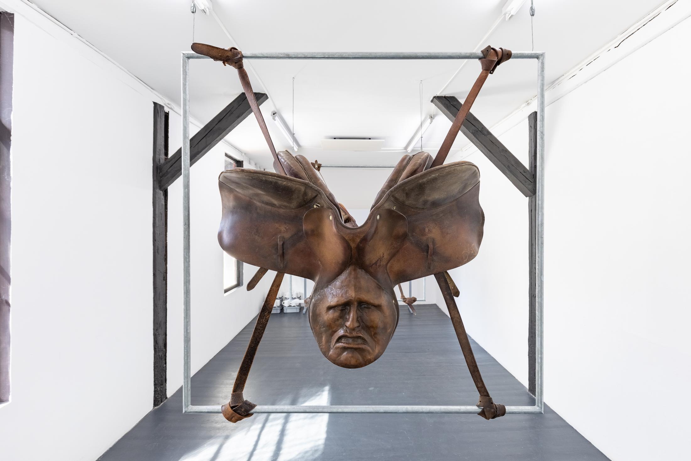 Exhibition View Duo Show «Robert Estermann and Oz Oderbolz; view on Oz Oderbolz, Dick Hammer, 2023, metal, leather saddle, epoxy, acrylic ink, 116 x 115 x 50 cm» at Last Tango, Zurich, 2023 / Photo: Kilian Bannwart / Courtesy: the artist and Last Tango