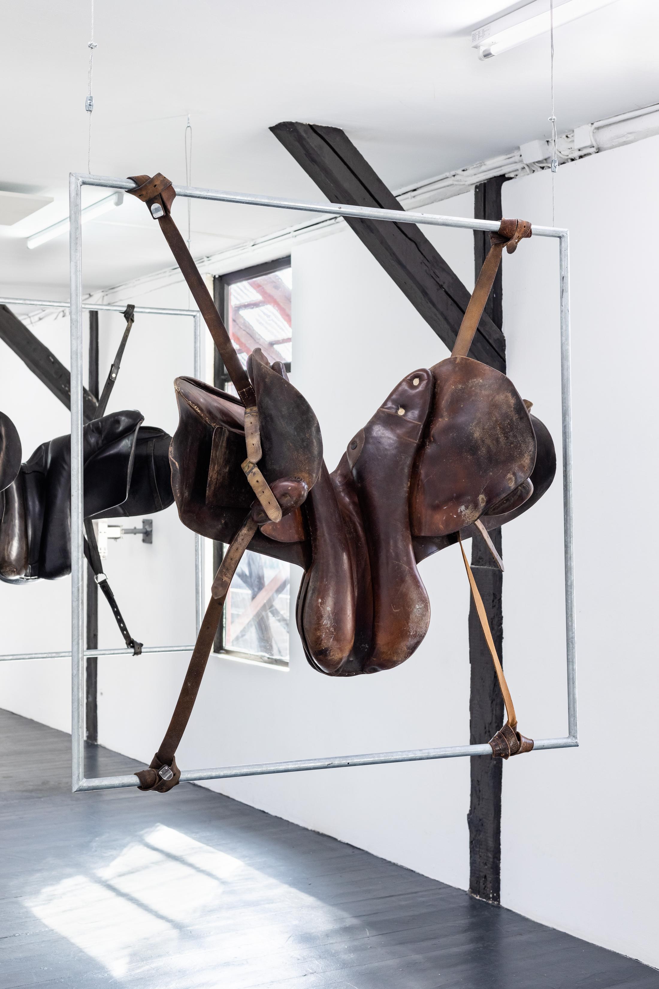 Exhibition View Duo Show «Robert Estermann and Oz Oderbolz; view on Oz Oderbolz, Dick Hammer, 2023, metal, leather saddle, epoxy, acrylic ink, 116 x 115 x 50 cm» at Last Tango, Zurich, 2023 / Photo: Kilian Bannwart / Courtesy: the artist and Last Tango