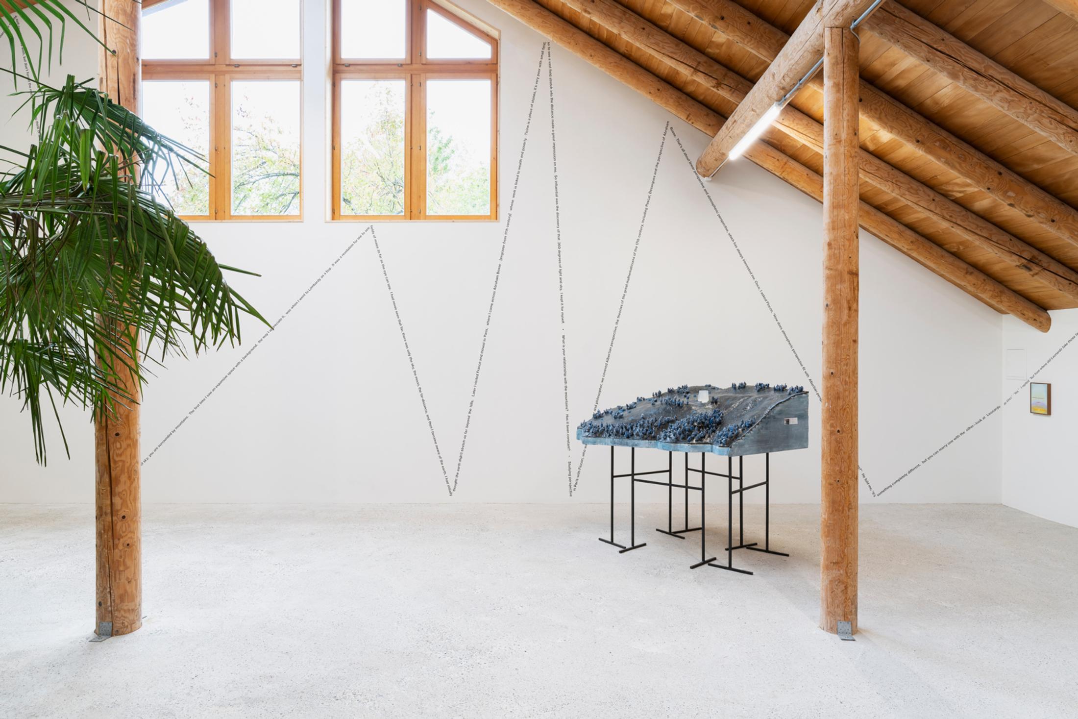 Exhibition View Group Show «This Morning, in the Sweet Torpor of the Great Forest, is Like Every Morning in the World; view on Peter Zumthor, Site model 1:500, built in 2014, Mountain Hotel Braunwald, Switzerland, Styrofoam, sand, wax, steel wool, soap, 55 x 166 x 163 cm» at Country SALTS, Bennwil, 2020 / Photo: Gunnar Meier / Courtesy: Permanent loan from the Ateliers Peter Zumthor to the Kunsthaus Bregenz