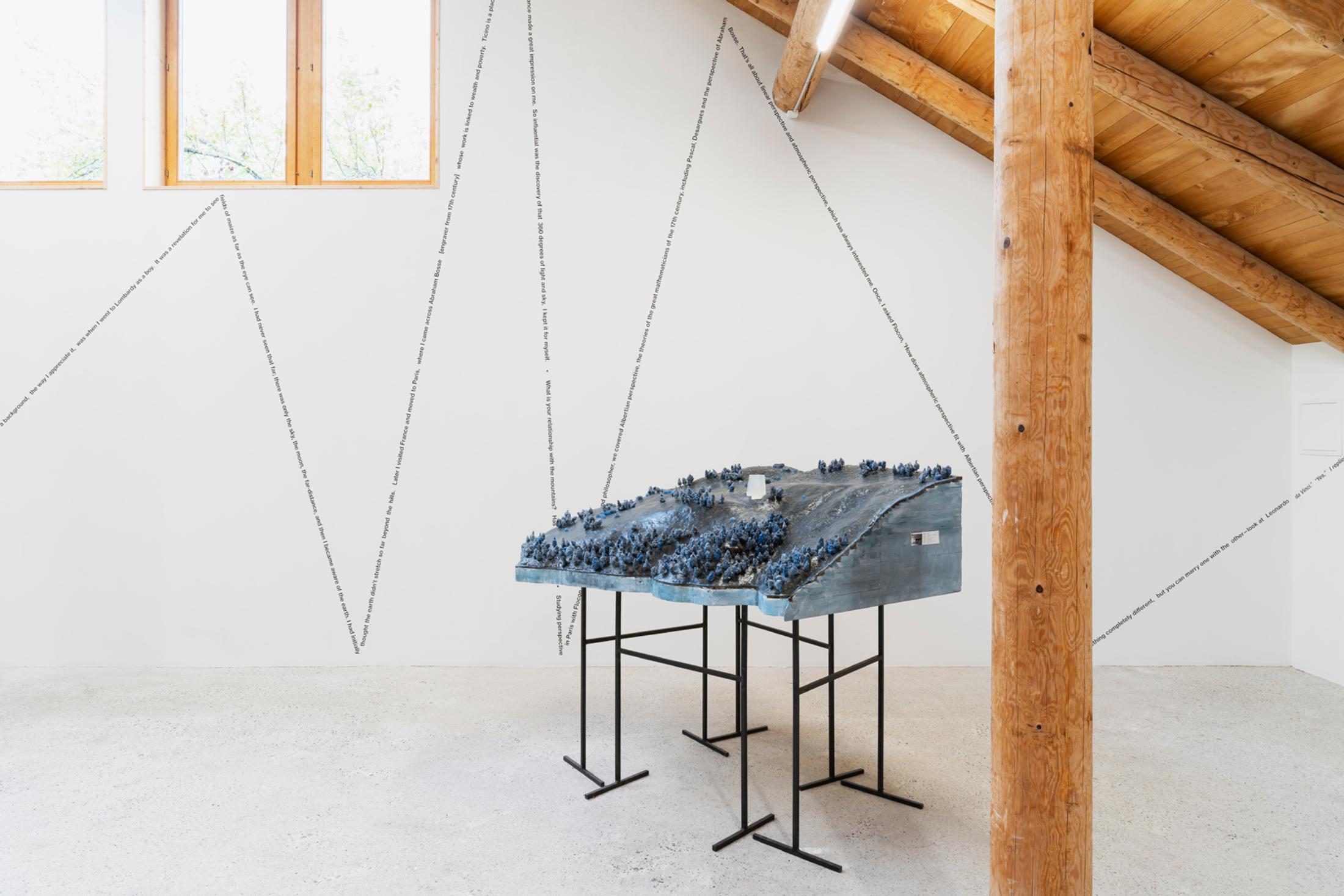 Exhibition View Group Show «This Morning, in the Sweet Torpor of the Great Forest, is Like Every Morning in the World; view on Peter Zumthor, Site model 1:500, built in 2014, Mountain Hotel Braunwald, Switzerland, Styrofoam, sand, wax, steel wool, soap, 55 x 166 x 163 cm» at Country SALTS, Bennwil, 2020 / Photo: Gunnar Meier / Courtesy: Permanent loan from the Ateliers Peter Zumthor to the Kunsthaus Bregenz