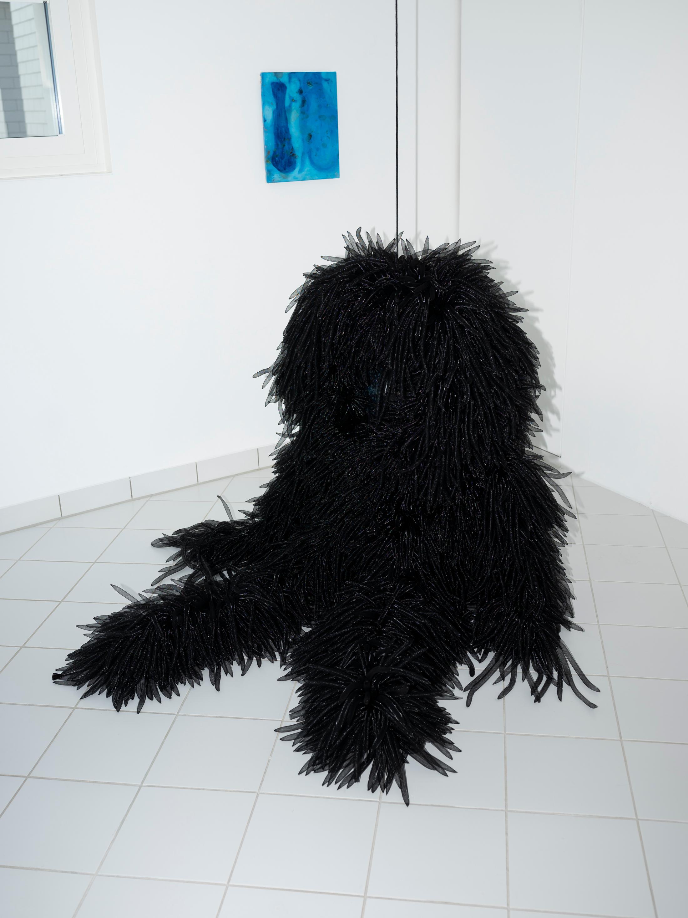 Exhibition View Group Show «Toast; view on Julie Monot, Armor amor, tubular hair, cotton and ceramic mask, variable dimensions, 2021» at A. Romy Gallery, Zurich, 2023 / Photo: Philip Frowein / Courtesy: the artist and A. Romy Gallery