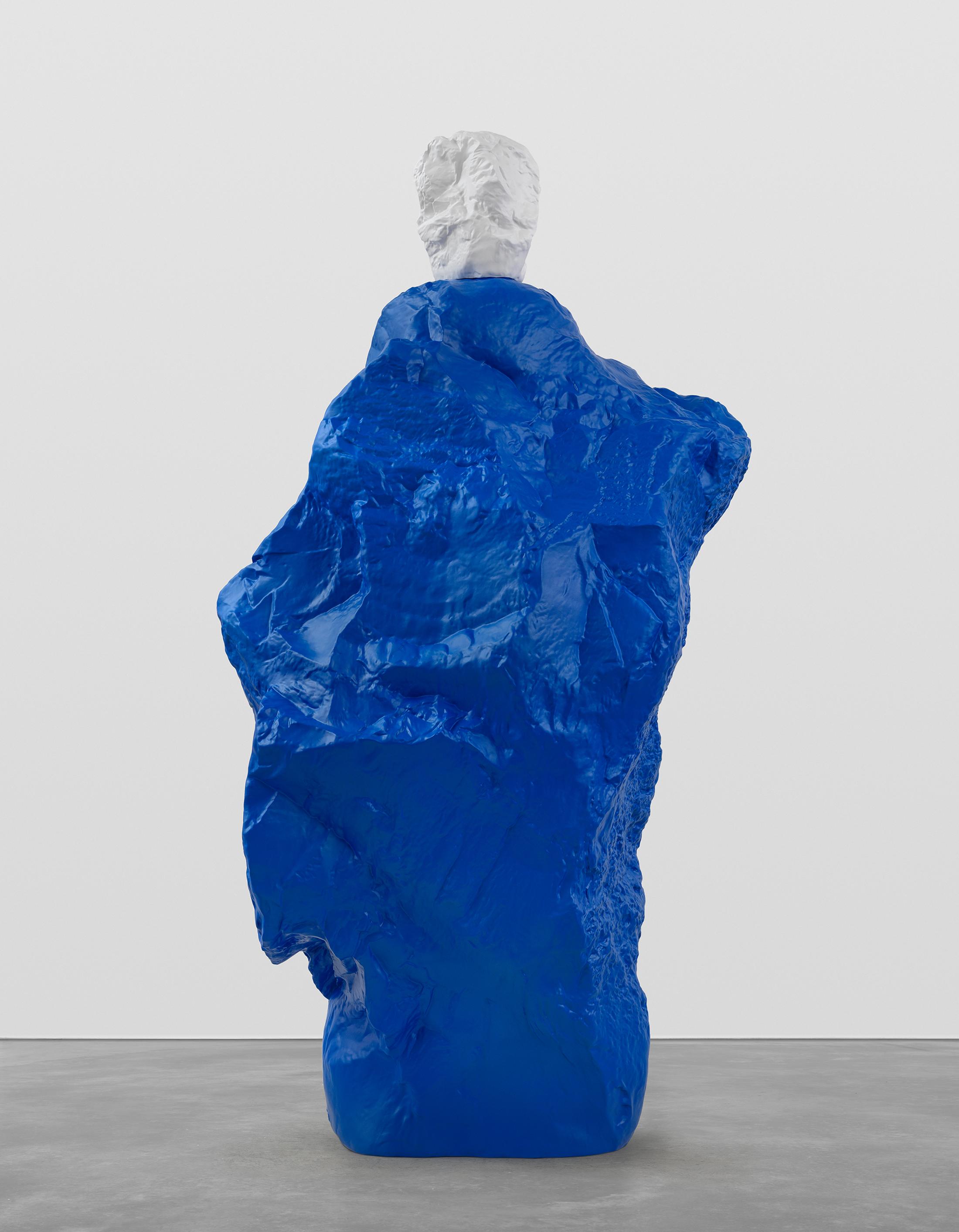 Exhibition View Ugo Rondinone Solo Show «nuns + monks; view on Ugo Rondinone, white blue monk, 2020, Painted bronze, 296.5 x 122 x 157 cm» at Galerie Eva Presenhuber, Maag Areal, Zurich, 2020 / Photo: Stefan Altenburger / © Ugo Rondinone / Courtesy the artist and Galerie Eva Presenhuber, Zurich / New York