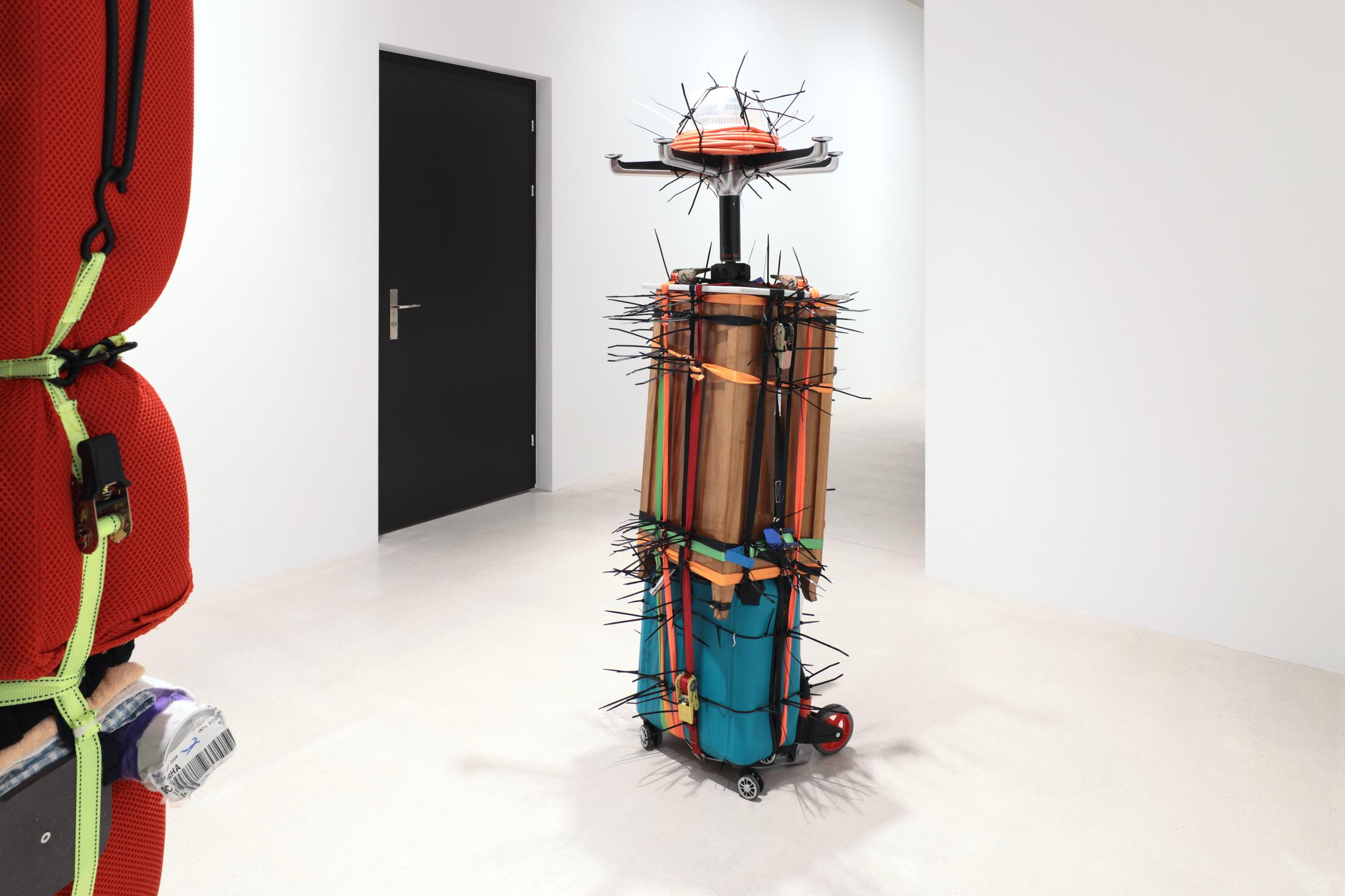 Exhibition View Umut Yasat Solo Show «35; view on Umut Yasat, Der Stapel 47, 2020-2022, 175 x 74 x 73cm, plastic, aluminium, cotton, cardboard, paper, glue, ink, stainless steel, air, lacquer, wood, marble, foam, felt, teflon, oil, iron, steel, wax, copper, styrofoam, perfume, glass» at Windhager von Kaenel, Zurich, 2022 / Courtesy: the artist and Windhager von Kaenel