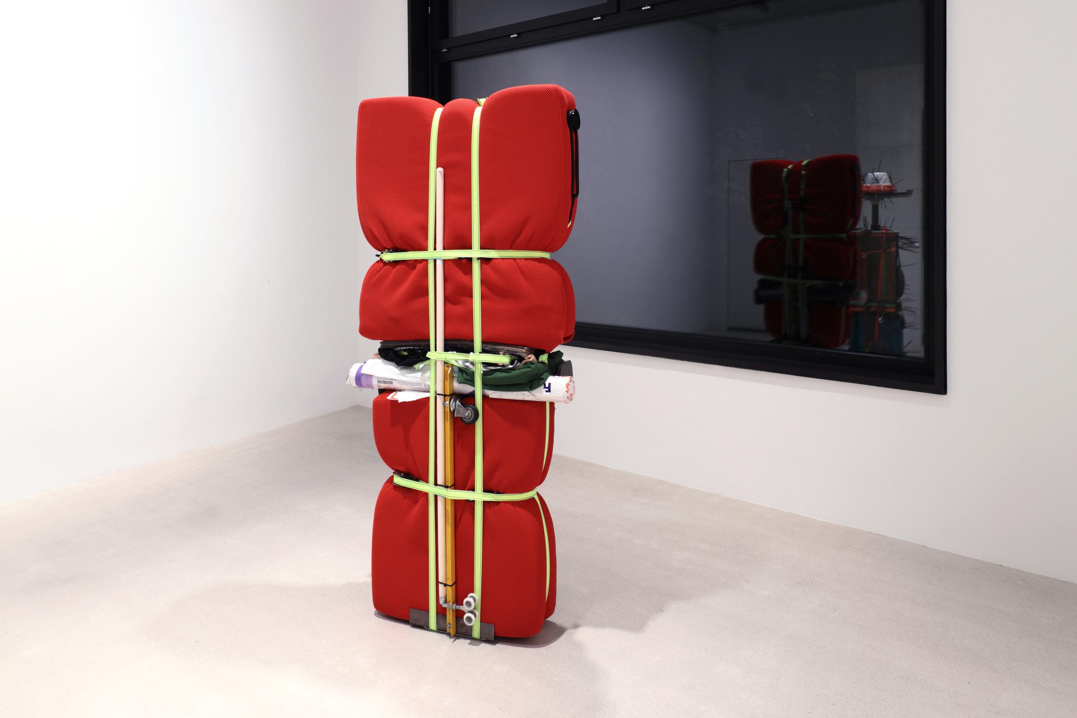 Exhibition View Umut Yasat Solo Show «35; view on Umut Yasat, Der Stapel 85, 2022, 175 x 79 x 43cm, aluminium, plastic, glass, paper, cotton, foam, steel, iron, stainless steel, ink, felt-tip pen, ballpoint pen, pencil, lacquer, cardboard, wood» at Windhager von Kaenel, Zurich, 2022 / Courtesy: the artist and Windhager von Kaenel