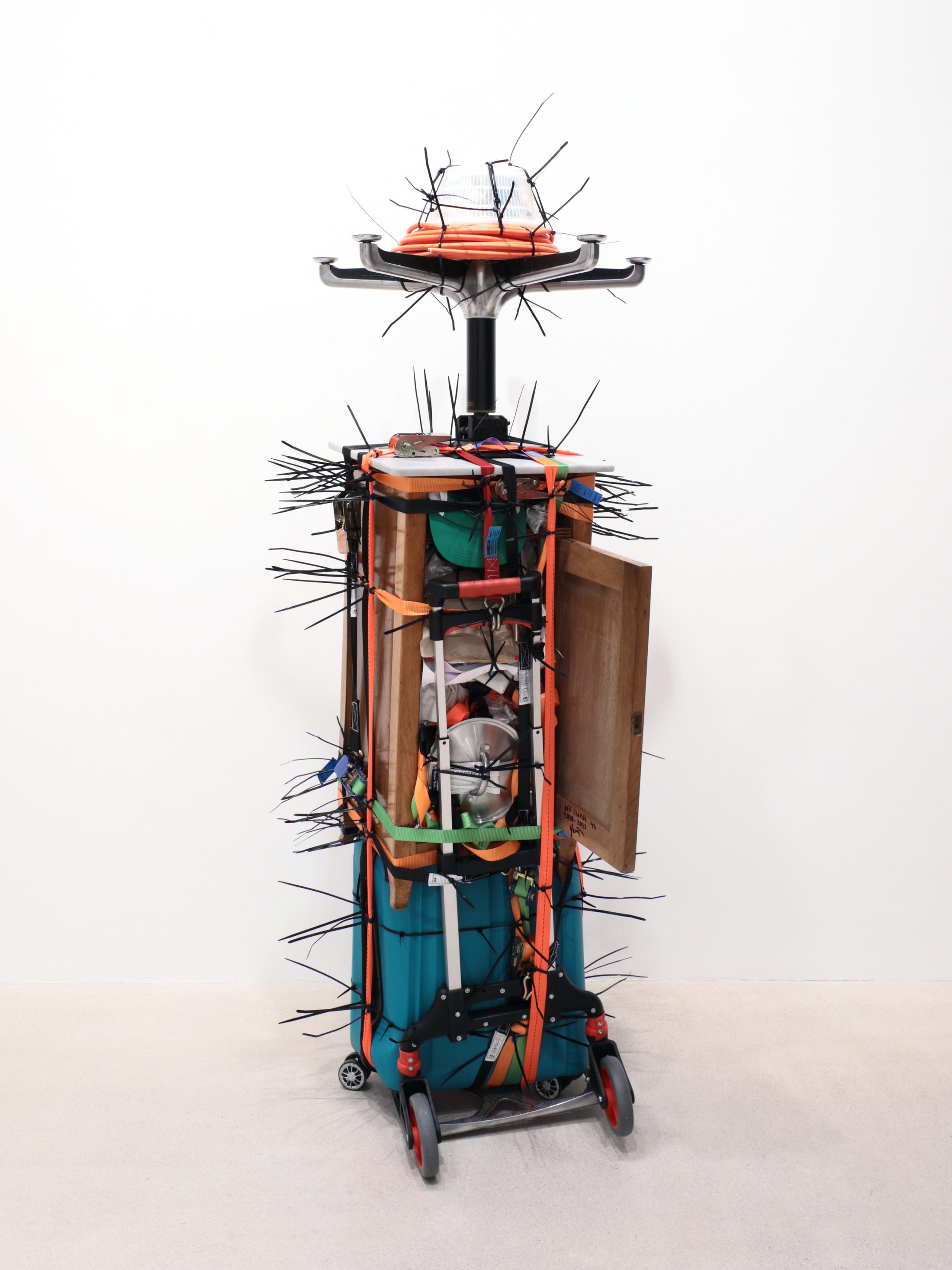 Exhibition View Umut Yasat Solo Show «35; view on Umut Yasat, Der Stapel 47, 2020-2022, 175 x 74 x 73 cm, plastic, aluminium, cotton, cardboard, paper, glue, ink, stainless steel, air, lacquer, wood, marble, foam, felt, teflon, oil, iron, steel, wax, copper, styrofoam, perfume, glass» at Windhager von Kaenel, Zurich, 2022 / Courtesy: the artist and Windhager von Kaenel