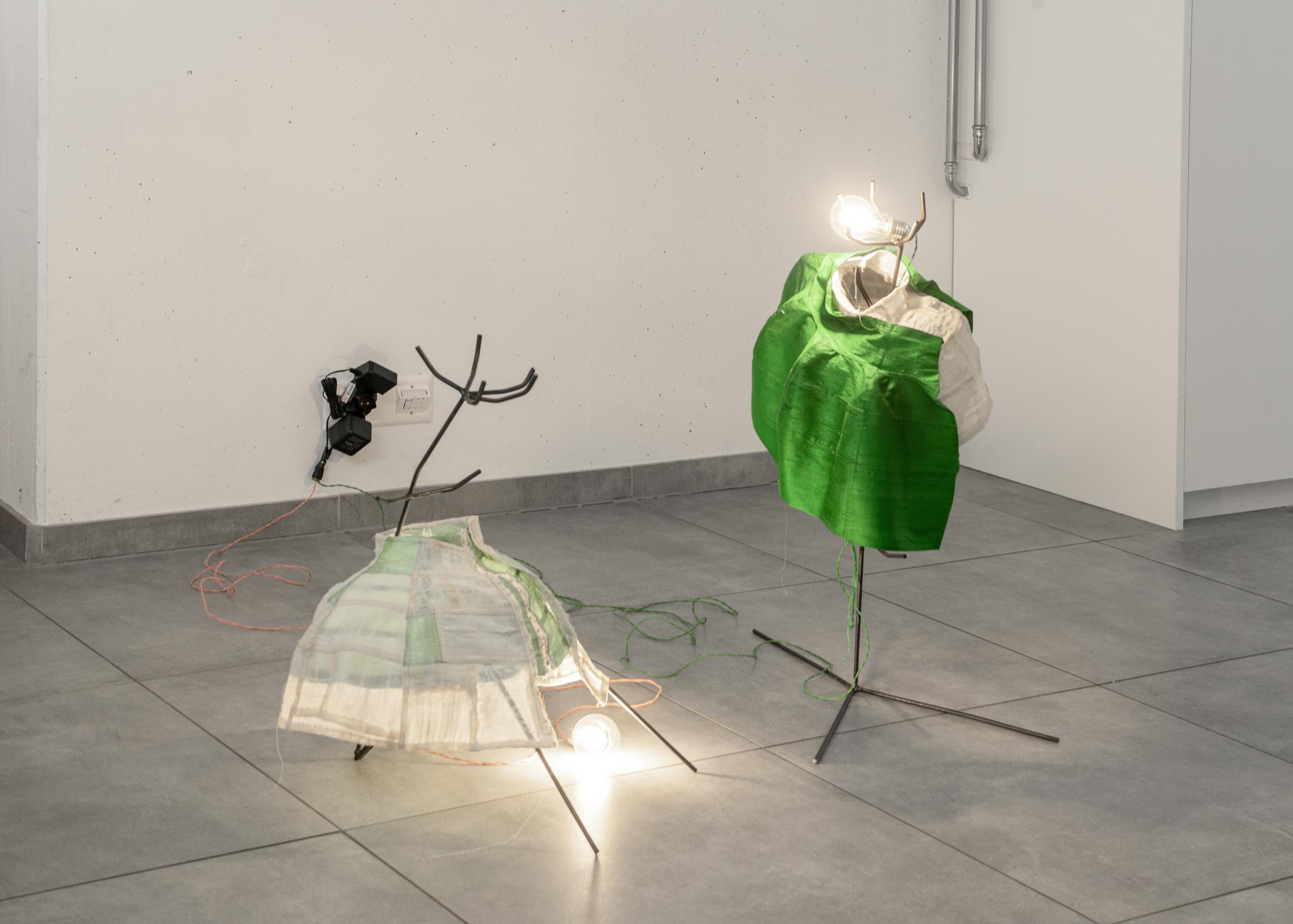 Exhibition View Group Show «Why do we say a house burns down, when the fire is burning up?; view on Karolin Braegger, Low-Slung Dress, 2022 and Actress I (Lamp), 2020» at All Stars, Lausanne, 2022 / Photo: Simon Rimaz / Courtesy: the artist and All Stars