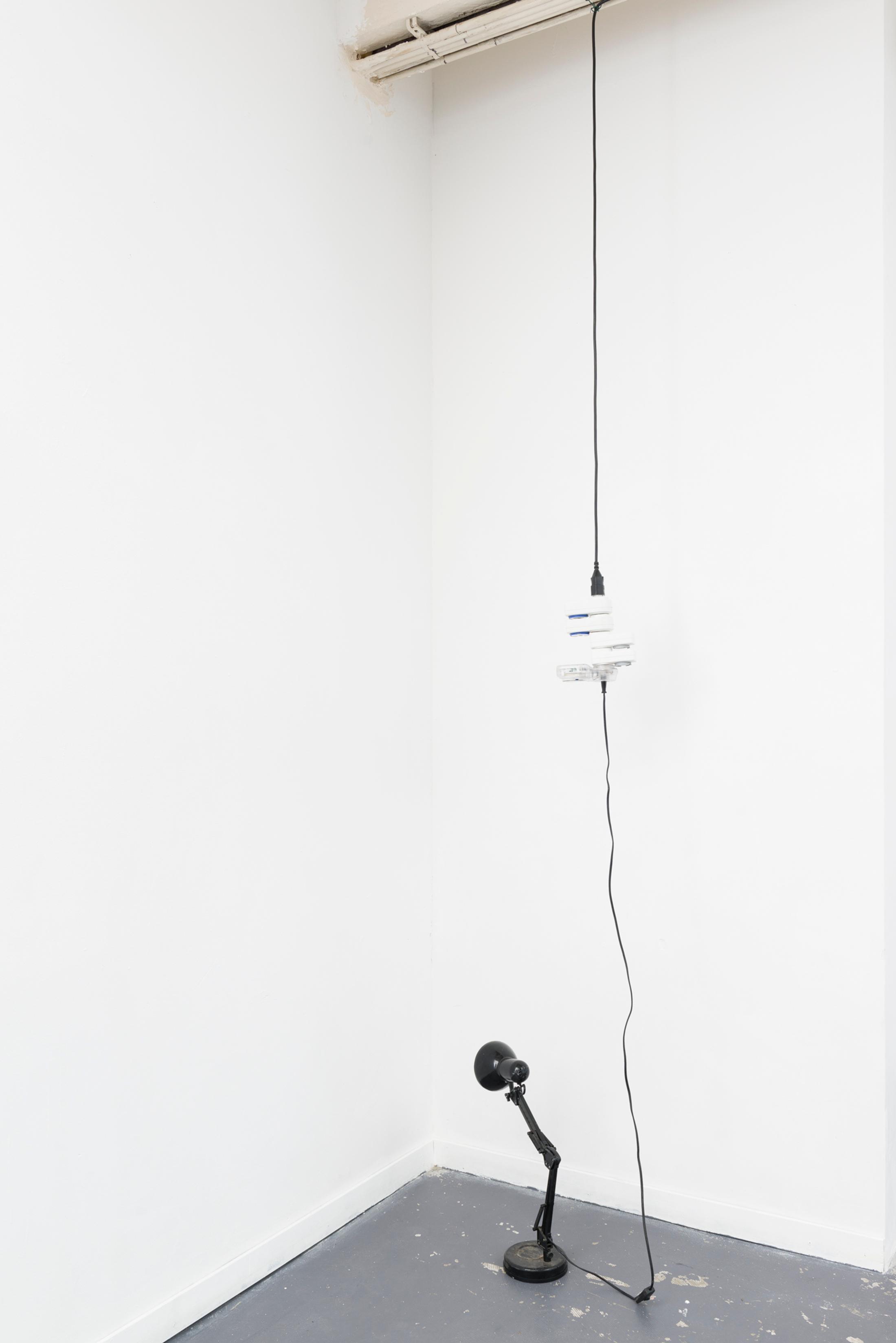 Exhibition View Yvan Alvarez & Paul Hutzli Duo Show «Why do pizza boxes have a square shape?; view on Yvan Alvarez, Fictional presence for safety, 2020, lamp, plug-in timers, dimensions variable» at Soul2Soul, Ressources Urbaines, Geneva, 2020 / © Yvan Alvarez / Courtesy: the artists