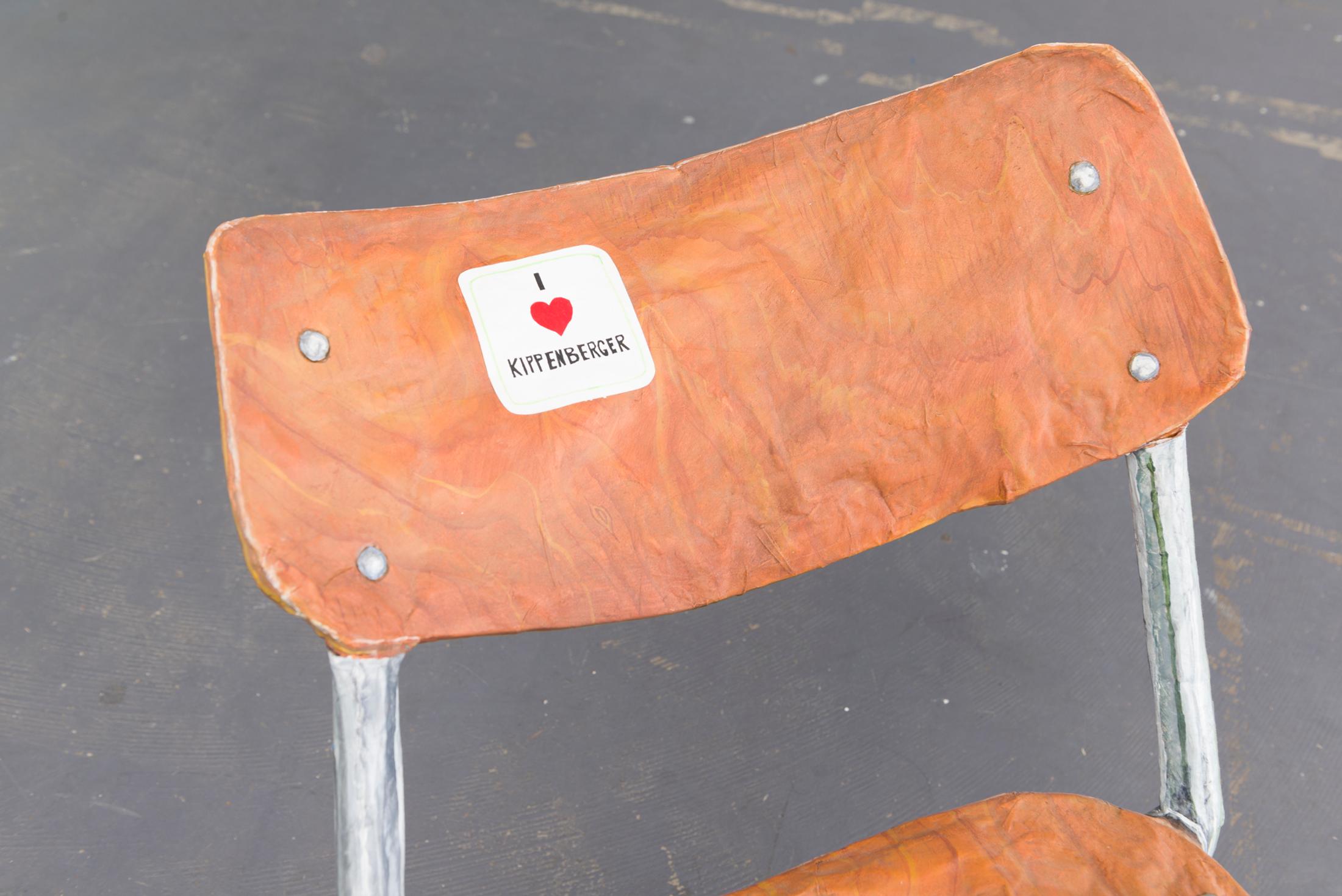 Exhibition View Yvan Alvarez & Paul Hutzli Duo Show «Why do pizza boxes have a square shape?; view on Paul Hutzli, A.A.A.B." (Chair), 2019, (detail), paper-mâché, painting, 65 x 40 x 70cm» at Soul2Soul, Ressources Urbaines, Geneva, 2020 / © Yvan Alvarez / Courtesy: the artists