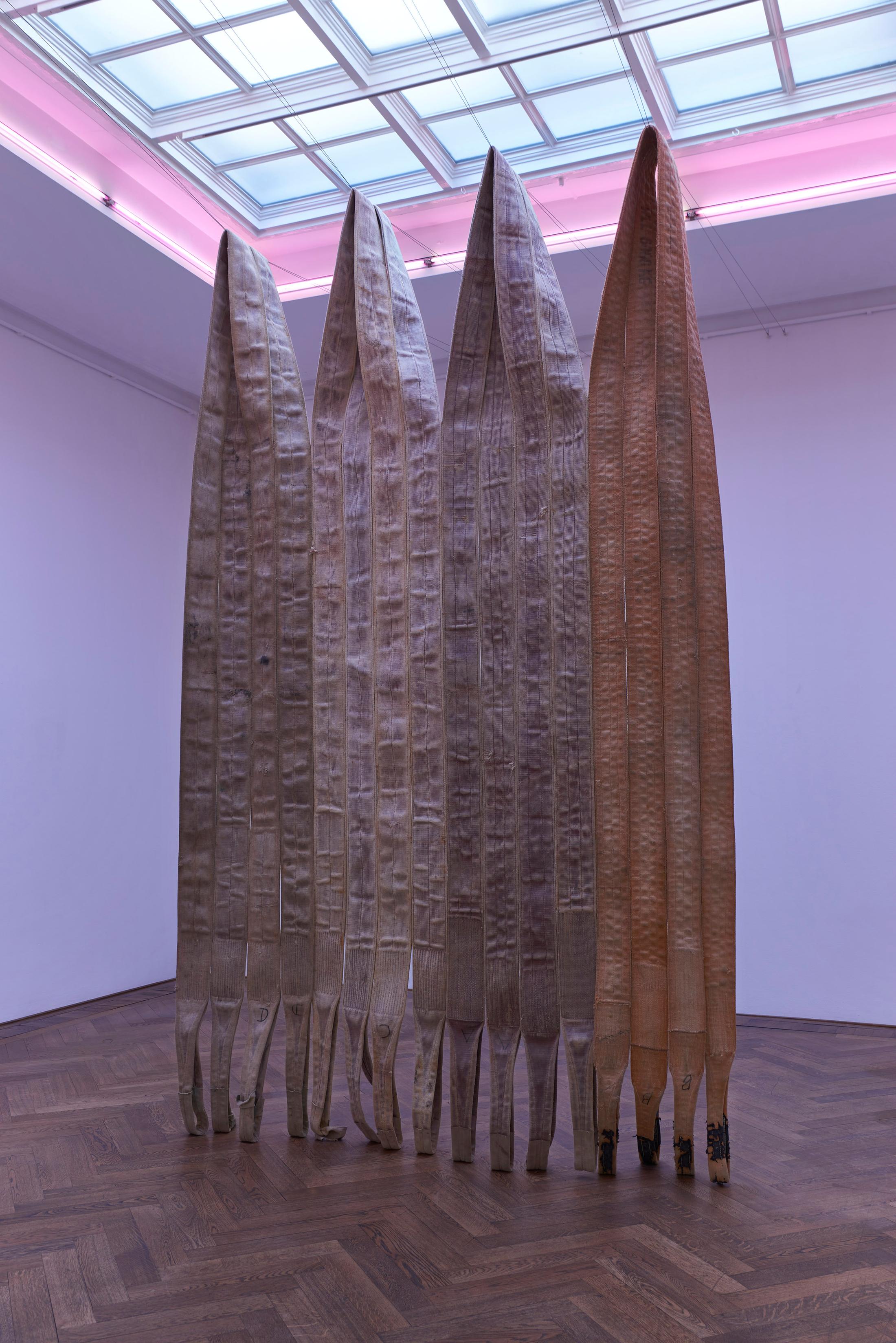 Exhibition View Alia Farid Solo Show «In Lieu of What Is; view on Alia Farid, Pipeline sling tapestry, 2022» at Kunsthalle Basel, Basel, 2022 / Photo: Philipp Hänger / Courtesy: the artist and Kunsthalle Basel