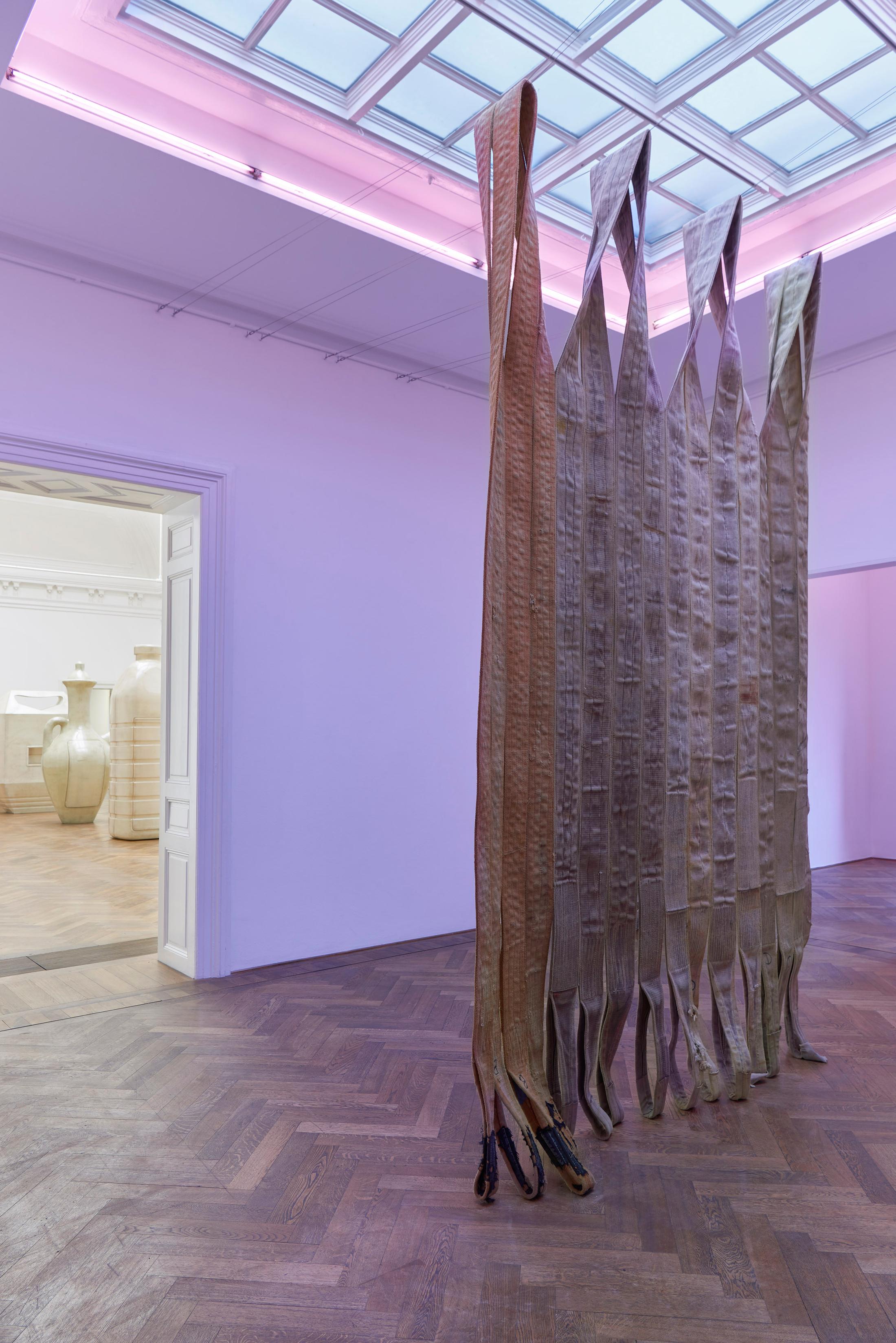 Exhibition View Alia Farid Solo Show «In Lieu of What Is; view on Alia Farid, Pipeline sling tapestry, 2022» at Kunsthalle Basel, Basel, 2022 / Photo: Philipp Hänger / Courtesy: the artist and Kunsthalle Basel