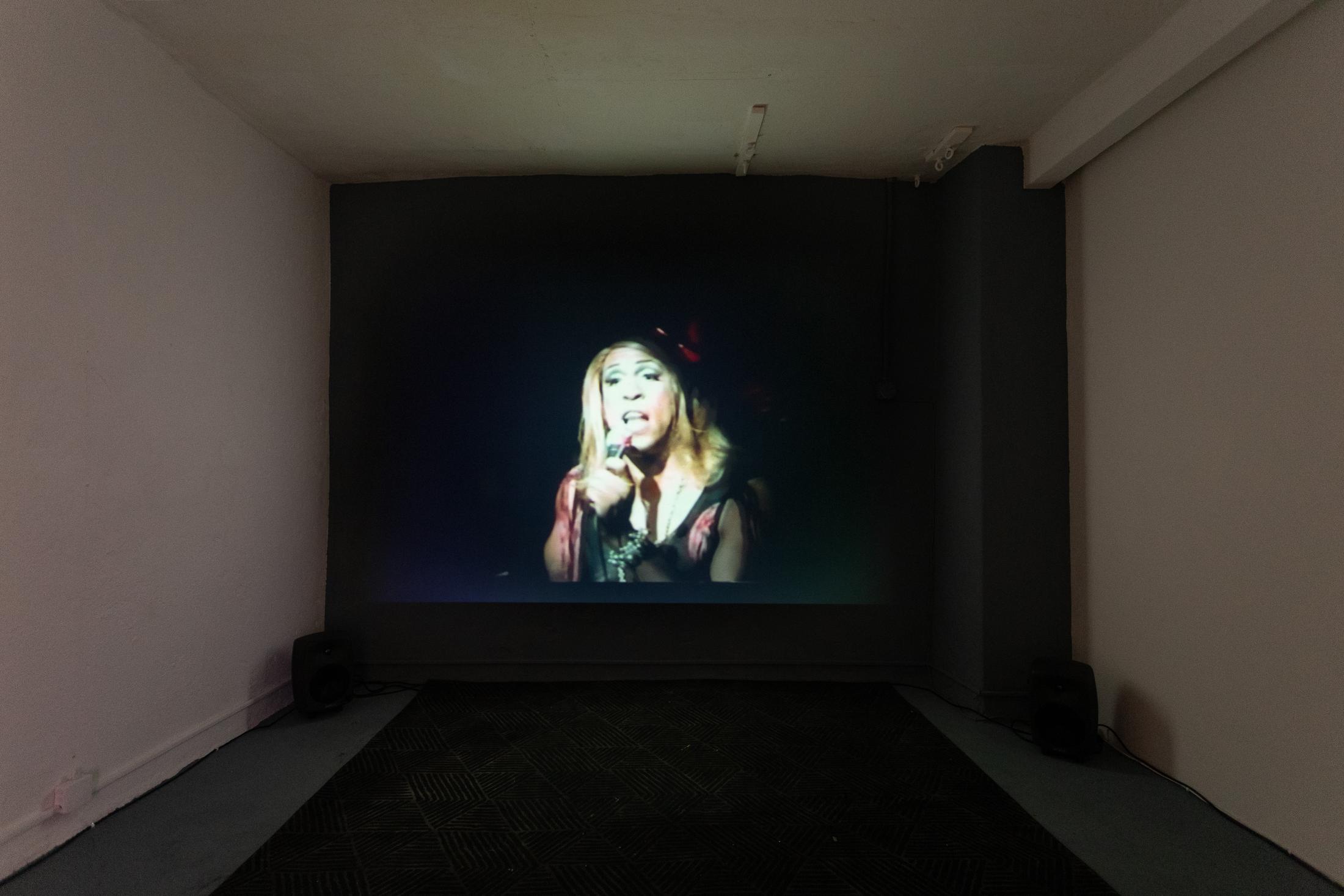 Exhibition View Groupshow «Can You Feel It?; view on Vaginal Davis, Cholita!, 1995, directed by Michelle Mills; Vaginal Davis, The Last Club Sucker, 1999, directed by Vaginal Davis» at Last Tango, Zurich, 2019 / Photo: Kilian Bannwart / Courtesy: the artist, Last Tango and Dan Gunn Gallery
