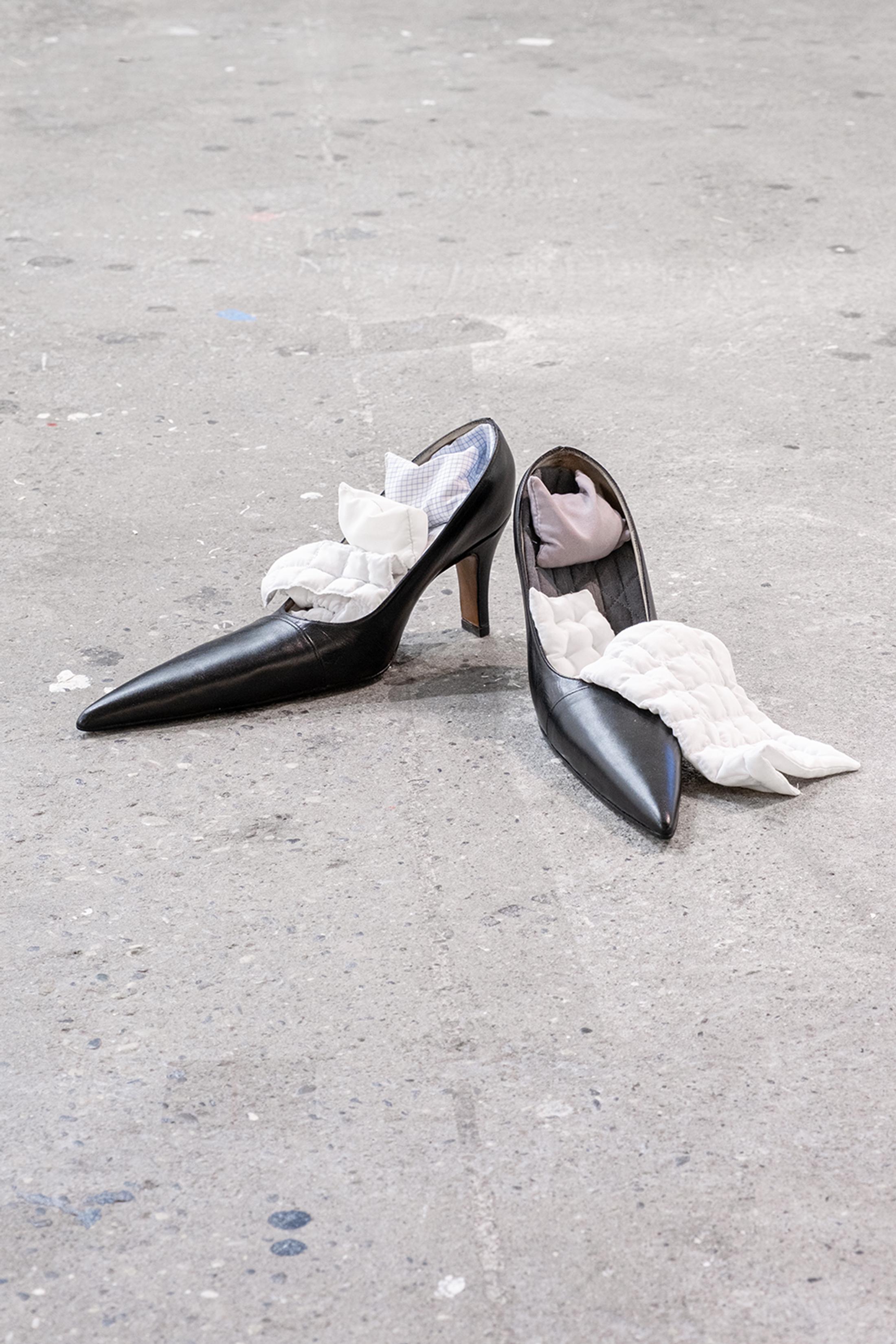 Exhibition View Group Show «Collections d’Artistes; view on Nina Rieben, Sidelines in a corner of potential, 2023, modified heels, textile objects, 15 x 15 x 35 cm each» at Le Commun, Geneva, 2025 / Photo: Daniel Leal / Courtesy: Spielact Festival
