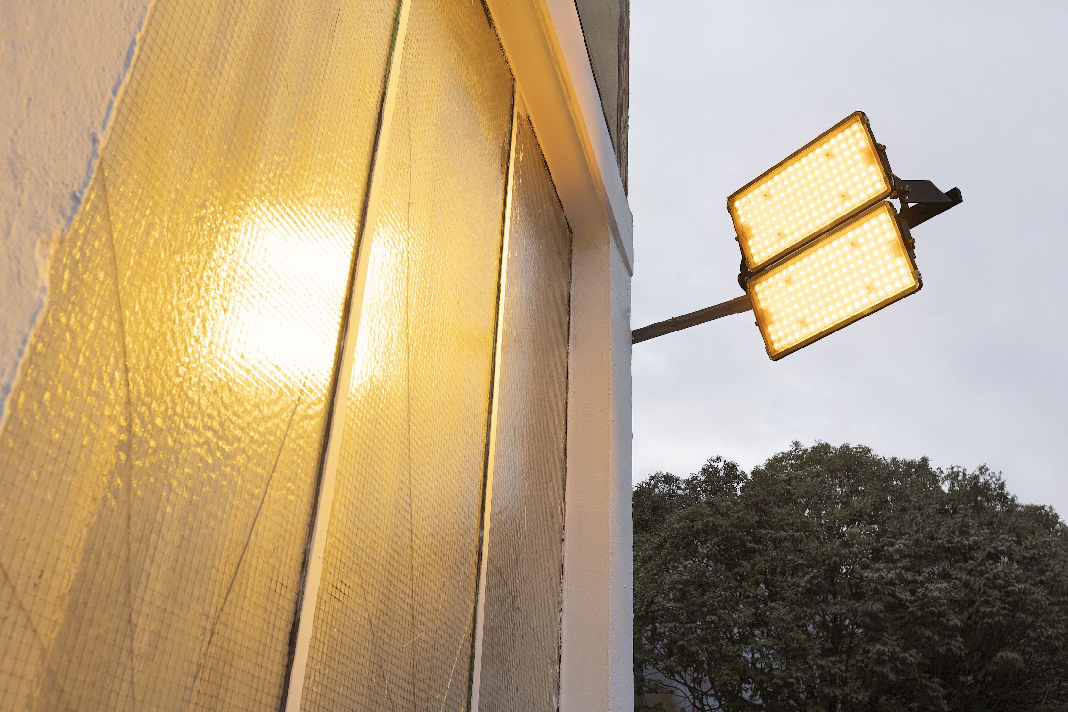 Exhibition View Solo Show Clément Grimm «Video 50 ; view on Ecclesiastes 1:14, 2025, Curtain, steel cable, LED light, gel filter, steel structure, Dimensions variable to space, Serie of 3 protocols - Edition 1/3» at Kissed Then Burned, Geneva, 2025-2026 / Photo: Antoni Aeby / Courtesy: the artist and Kissed Then Burned