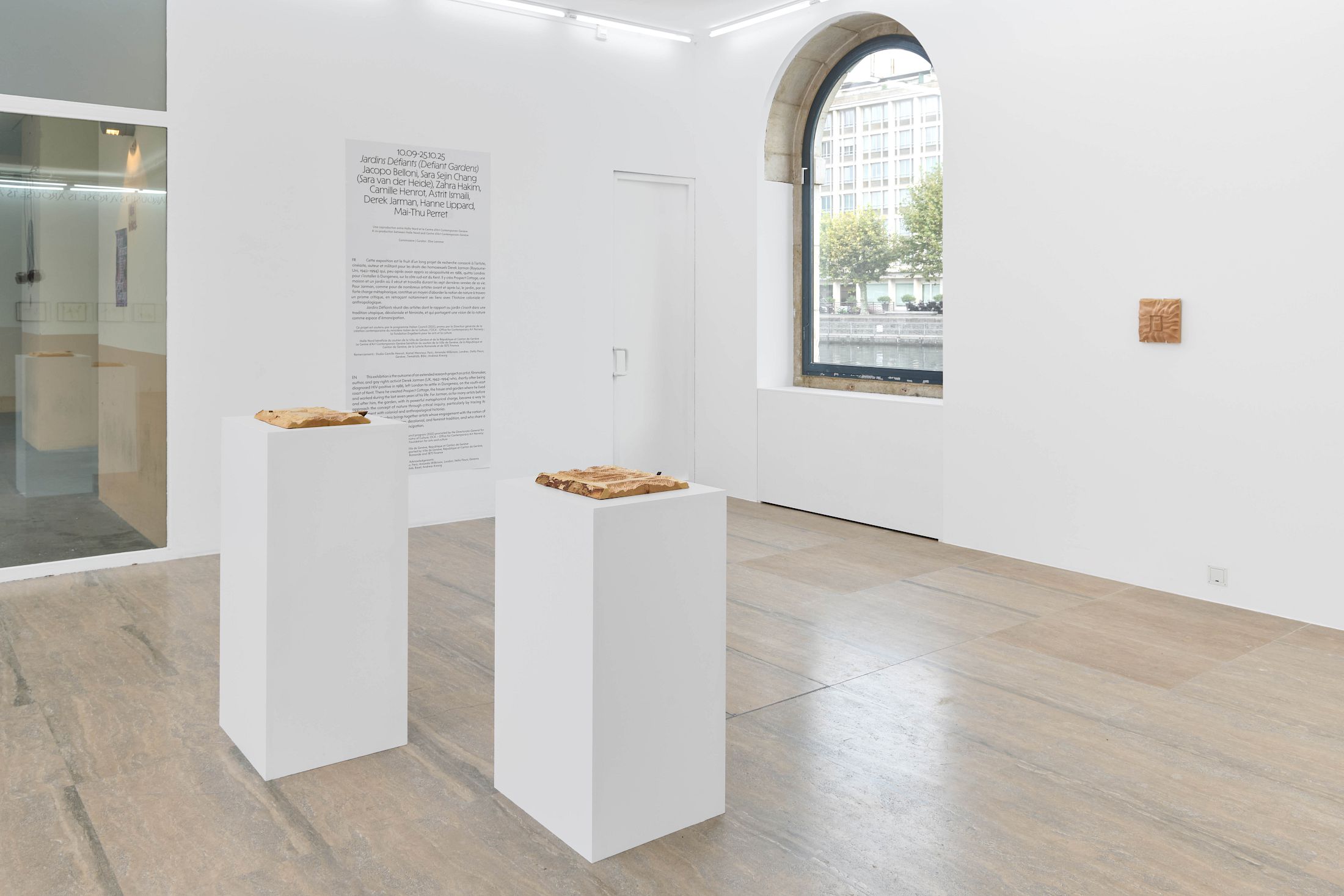 Exhibition View Group Show «Defiant Gardens ; view on Zahra Hakim, Un Éclat d’une Lumière Perdue I, II & III, 2025, Carved wood» at Halle Nord, Geneva, 2025 / Photo: Thomas Maisonnasse / Courtesy: the artists and Halle Nord