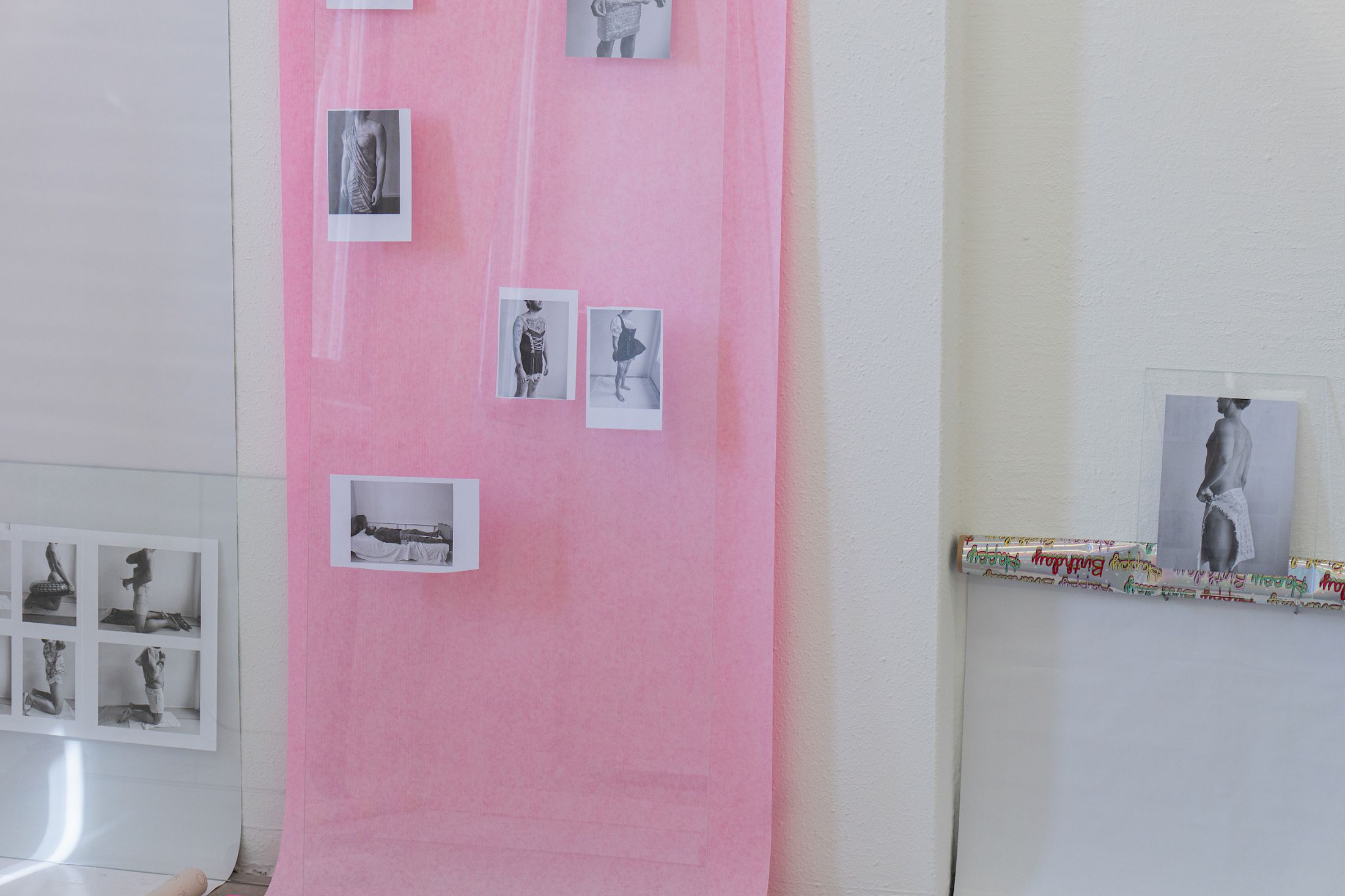 Exhibition View Solo Show Sven Gex «celebratory ; view on printed images from the ‚character fitting‘ series 2021-ongoing, gift wrapping paper, nails, glass» at Halmet, Zurich-Oerlikon, 2025 / Photo: Tereza Glazova / Courtesy: the artist and Halmet