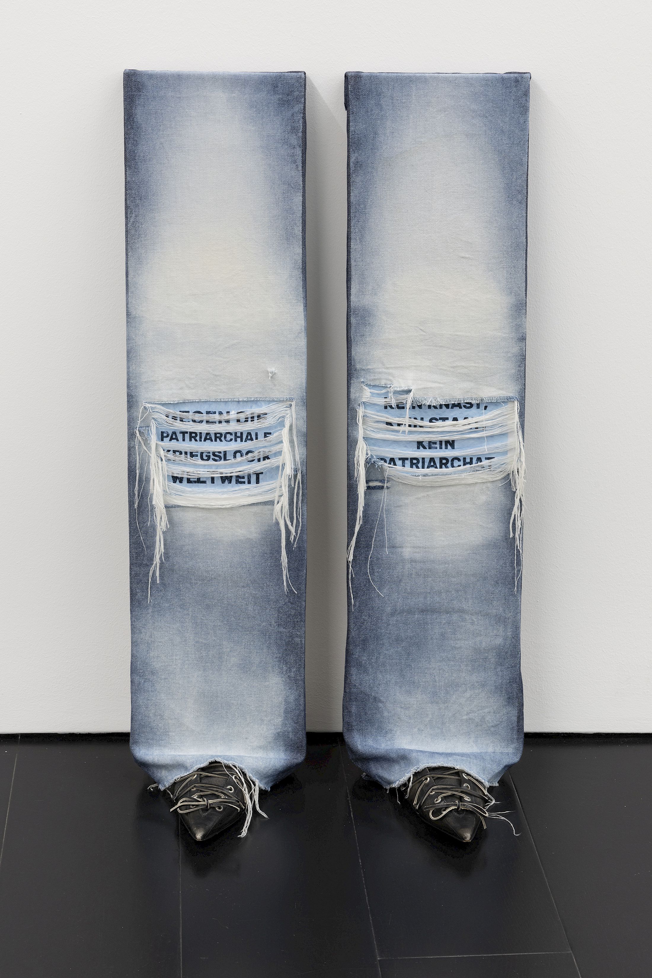 Exhibition View Group Show «Zu Gast in einer Strasse ; view on Mattia Comuzzi, Standpunkte, 2024, Denim, Wood Panels, ink- jet prints on matt paper, Acne SS24 leather slippers, 50 x 90 x 30 cm» at Contemporary Fine Arts, Basel, 2026 / Photo: Gina Folly / Courtesy: the artists and Contemporary Fine Arts