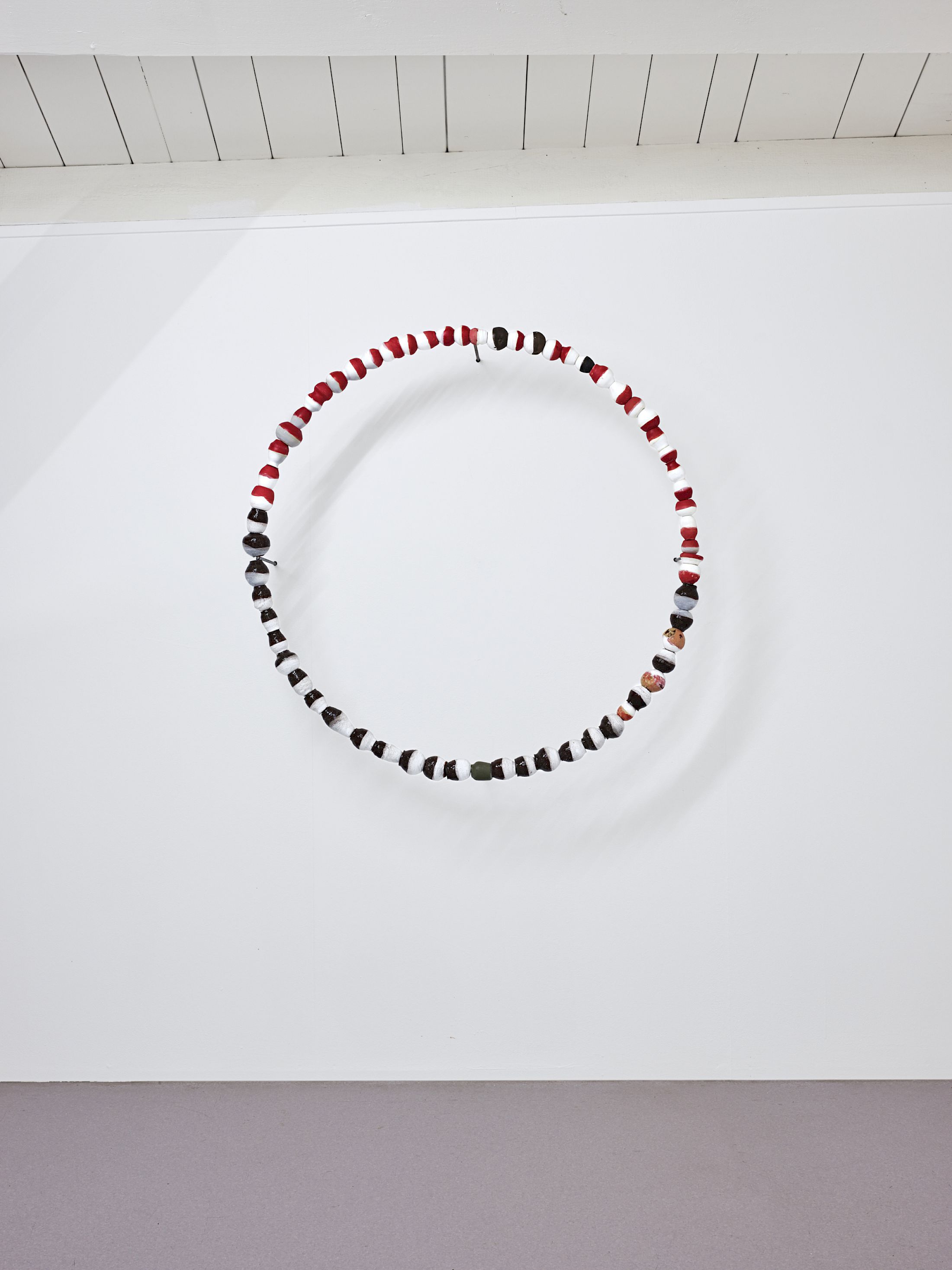 Exibition View Solo Show Camille Dumond «Everything but sliced ; view on Some things that used to be edible are lethal now (harvest 1), 2025, part of a series of three circles on the wall, earthenware, steel, 100 × 100 cm» at Ferme de la Chapelle, Geneva, Grand-Lancy, 2025 / Photo: Nicolas Delaroche / Courtesy: the artist and Ferme de la Chapelle
