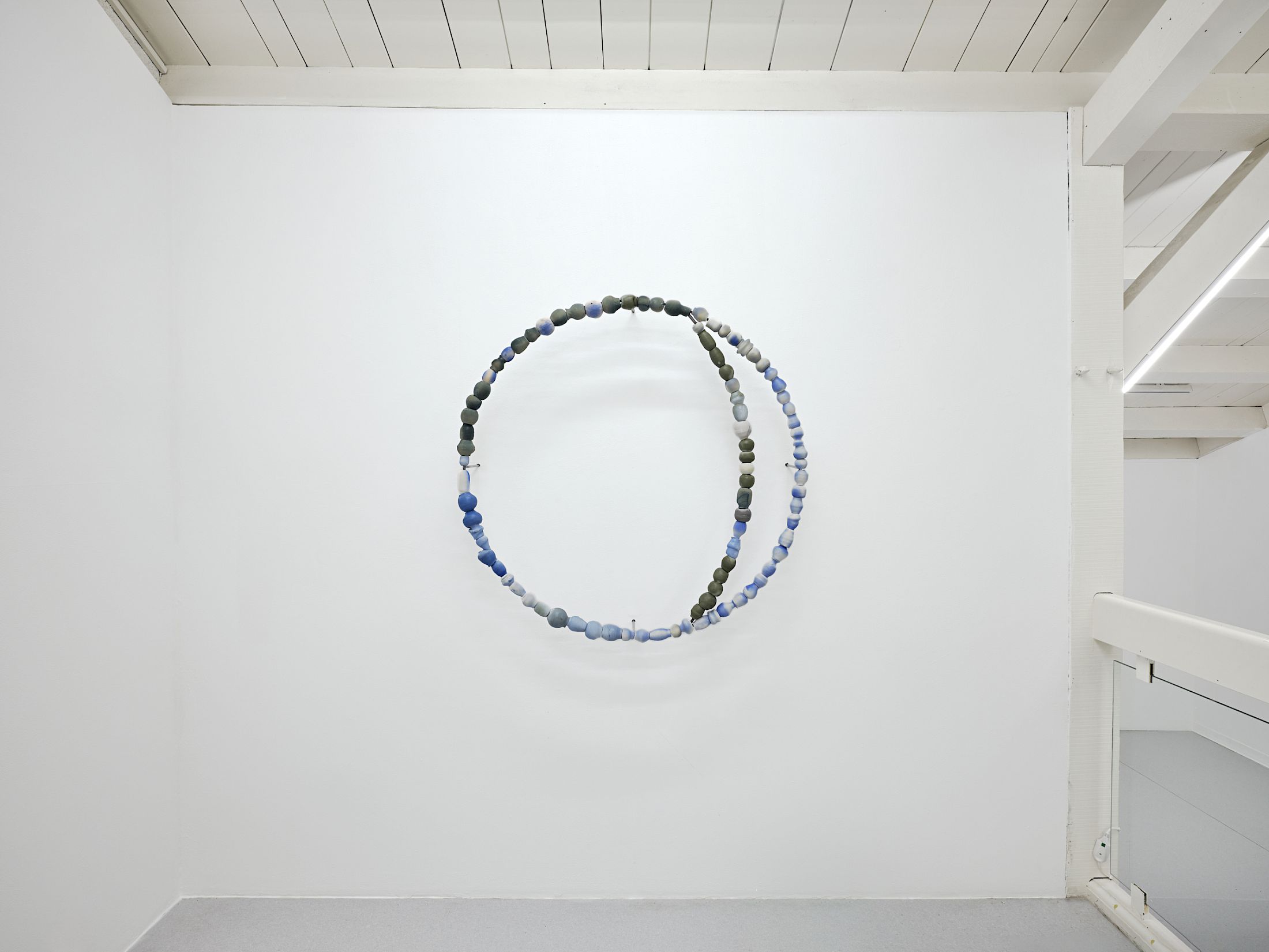 Exibition View Solo Show Camille Dumond «Everything but sliced ; view on Some things that used to be edible are lethal now (harvest 2), 2025, part of a series of three circles on the wall, earthenware, steel, 100 × 100 cm» at Ferme de la Chapelle, Geneva, Grand-Lancy, 2025 / Photo: Nicolas Delaroche / Courtesy: the artist and Ferme de la Chapelle
