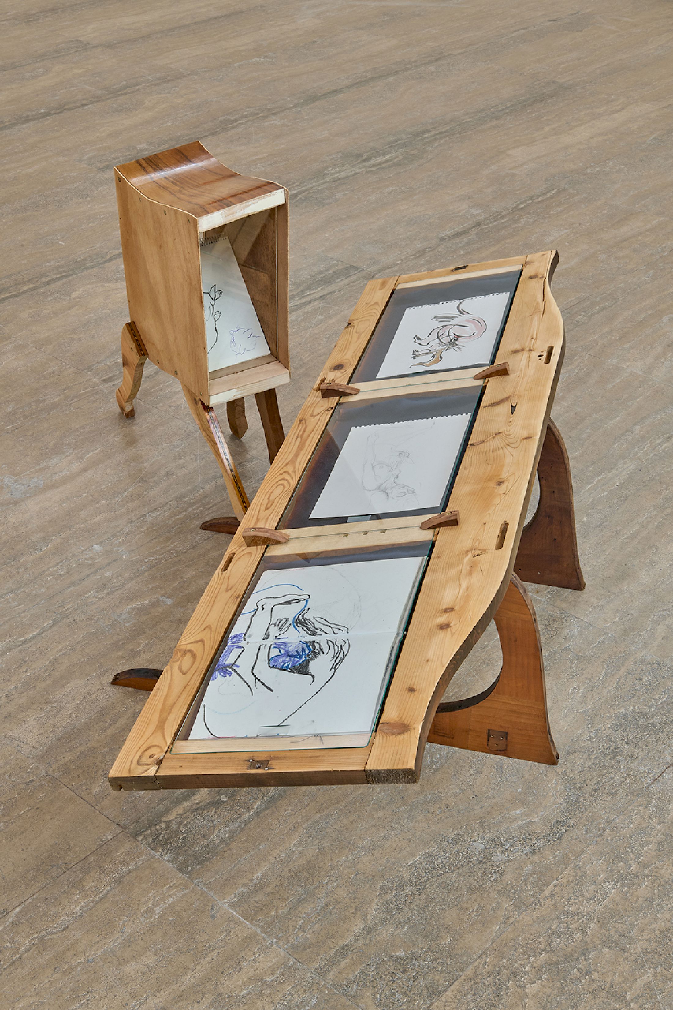 Exhibition View Duo Show Cathy Josefowitz and Jessy Razafimandimby «Valse Velue ; view on J. Razafimandimby, Kolibrie, 2025, Wood, glass, satin, Variable dimensions ; C. Josefowitz, untitled, c. 1987, Gouache, 29,5 x 20,8 cm ; C. Josefowitz, untitled, year unknown, Pencil on paper, 21 x 30 cm ; C. Josefowitz, untitled, 1980, Pastel on paper, 4.8 x 19 cm ; J. Razafimandimby, Filin, 2025, Wood, glass, Variable dimensions, C. Josefowitz, untitled, c. 1975, Ink on paper, 16 x 24 cm» at Halle Nord, Geneva, 2026 / Photo: Thomas Maisonnasse / Courtesy: the artists and Halle Nord