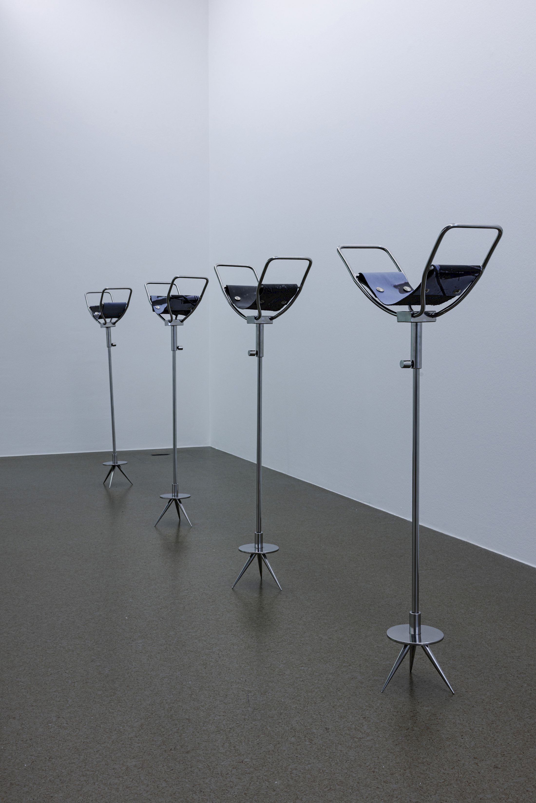 Exhibition View Dorota Gawęda & Eglė Kulbokaitė Solo Show «Death by Landscape; view on Dorota Gawęda & Eglė Kulbokaitė, Spectators (I-III), 2020, polished stainless steel, print on leather» at Haus für Kunst Uri, Altdorf, 2025 / Photo: Franz-Xaver Brun / Courtesy: the artists and Haus für Kunst Uri