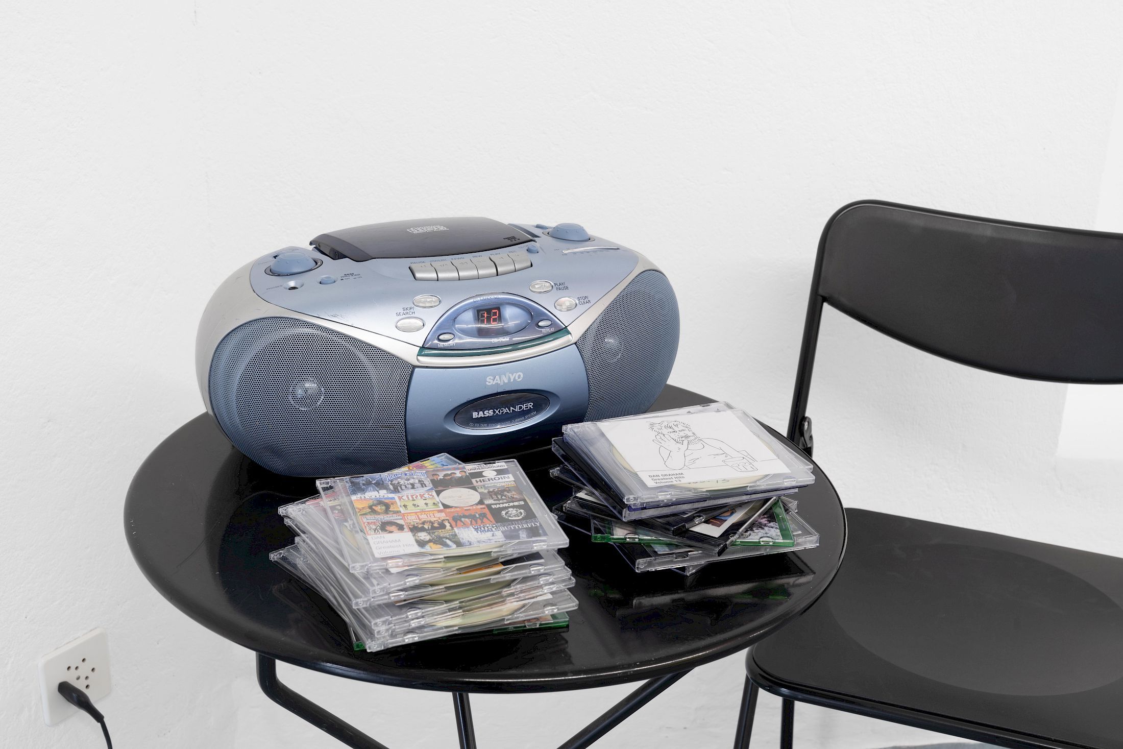 Exhibition View Group Show «Ecstatic Trance: Artists on Rock My Religion ; view on Dan Graham, Dan Graham’s Greatest Hits, Volume 1 - 21 + The Kinks, 2004–2022/2025, 22 compact discs and inkjet prints» at marytwo, Luzern, 2025-2026 / Photo: Jack Pryce / Courtesy: The Dan Graham and Mieko Graham Foundation