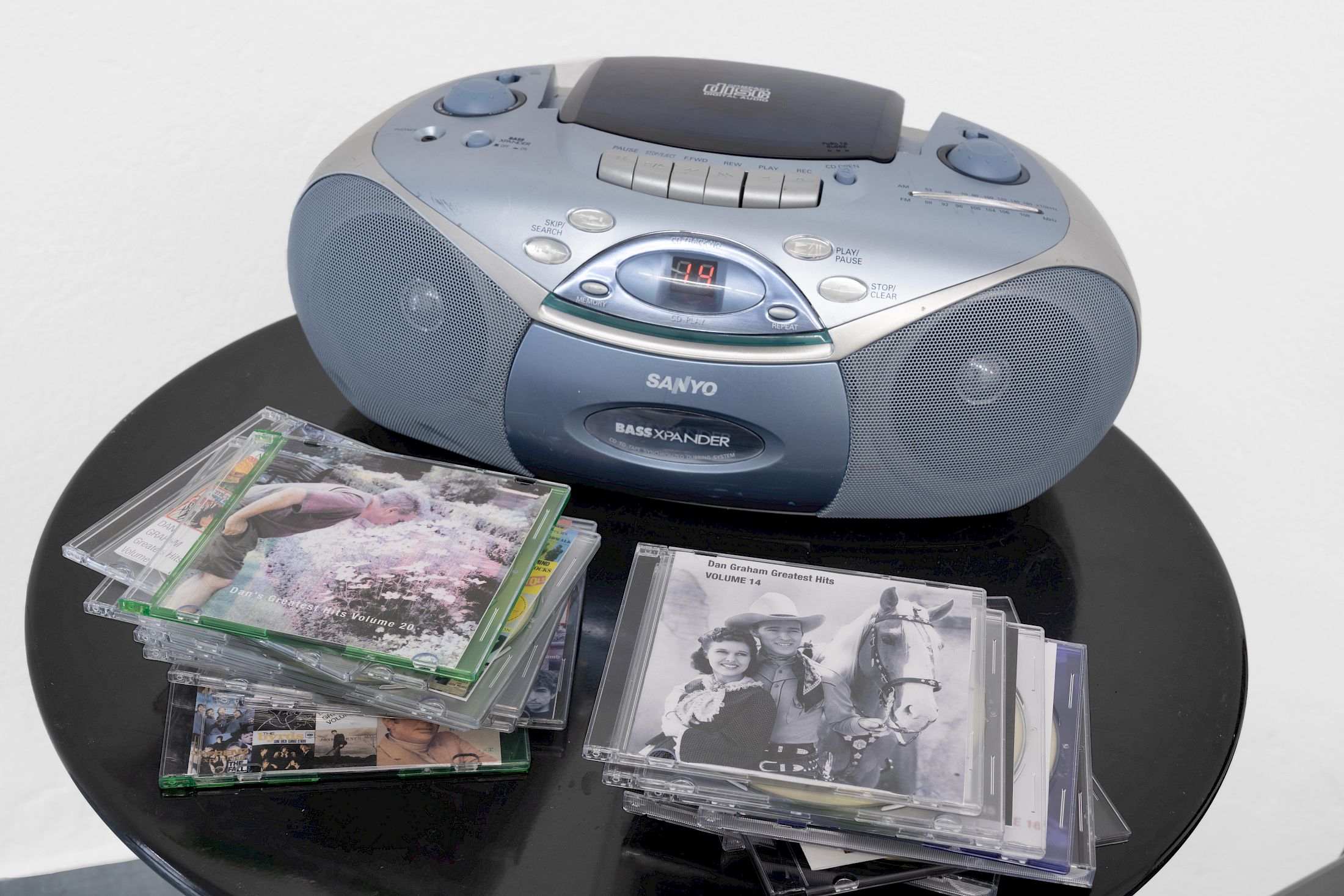 Exhibition View Group Show «Ecstatic Trance: Artists on Rock My Religion ; view on Dan Graham, Dan Graham’s Greatest Hits, Volume 1 - 21 + The Kinks, 2004–2022/2025, 22 compact discs and inkjet prints» at marytwo, Luzern, 2025-2026 / Photo: Jack Pryce / Courtesy: The Dan Graham and Mieko Graham Foundation