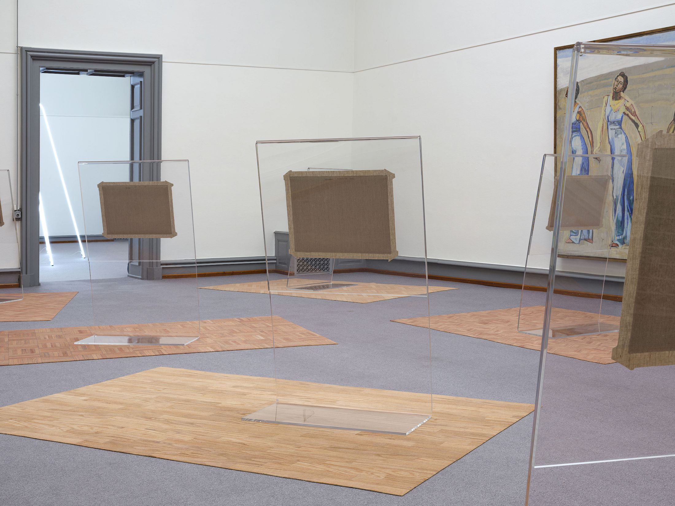 Exhibition View Solo Show Francisco Sierra «Alfombra ; view on O Sole Tuo (detail), 2025, Canvas in custom made plexiglas display on printed carpet, each approx. 170 × 300 × 200 cm» at Kunstmuseum Solothurn, 2025-2026 / Photo: Sebastian Verdon / Courtesy: the artist and von Bartha