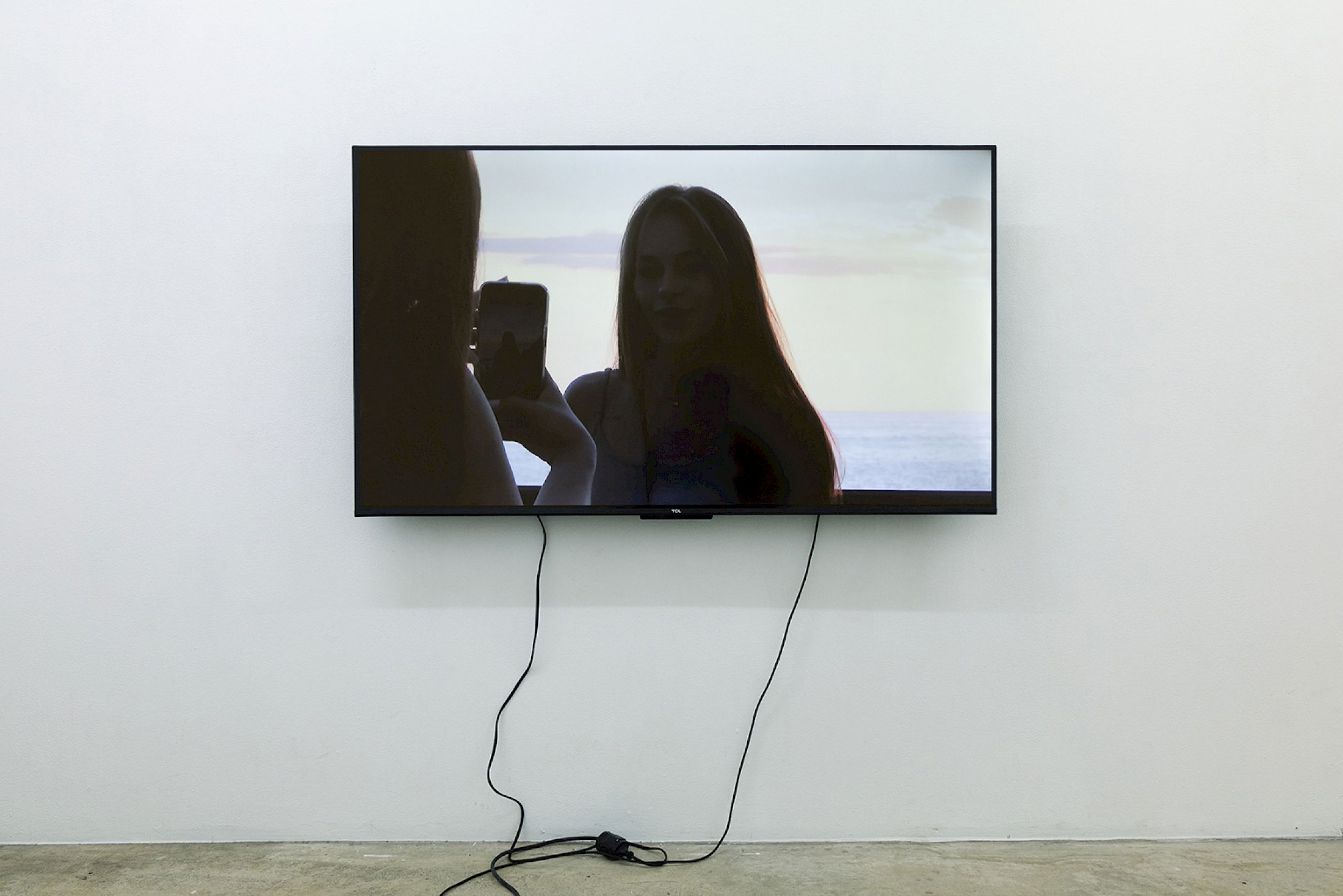 Exhibition View Solo Show Jiajia Zhang «How To Spend It ; view on Vacation (after HG) , 2025, HD Video, 16:9, 7’28‘‘, Color, Sound, Voiceover with kind permission from Heike Geißler, tacheles! and Hanser Berlin» at Milieu, Bern, 2025 / Photo: Jiří Makovec / Courtesy: the artist and Milieu