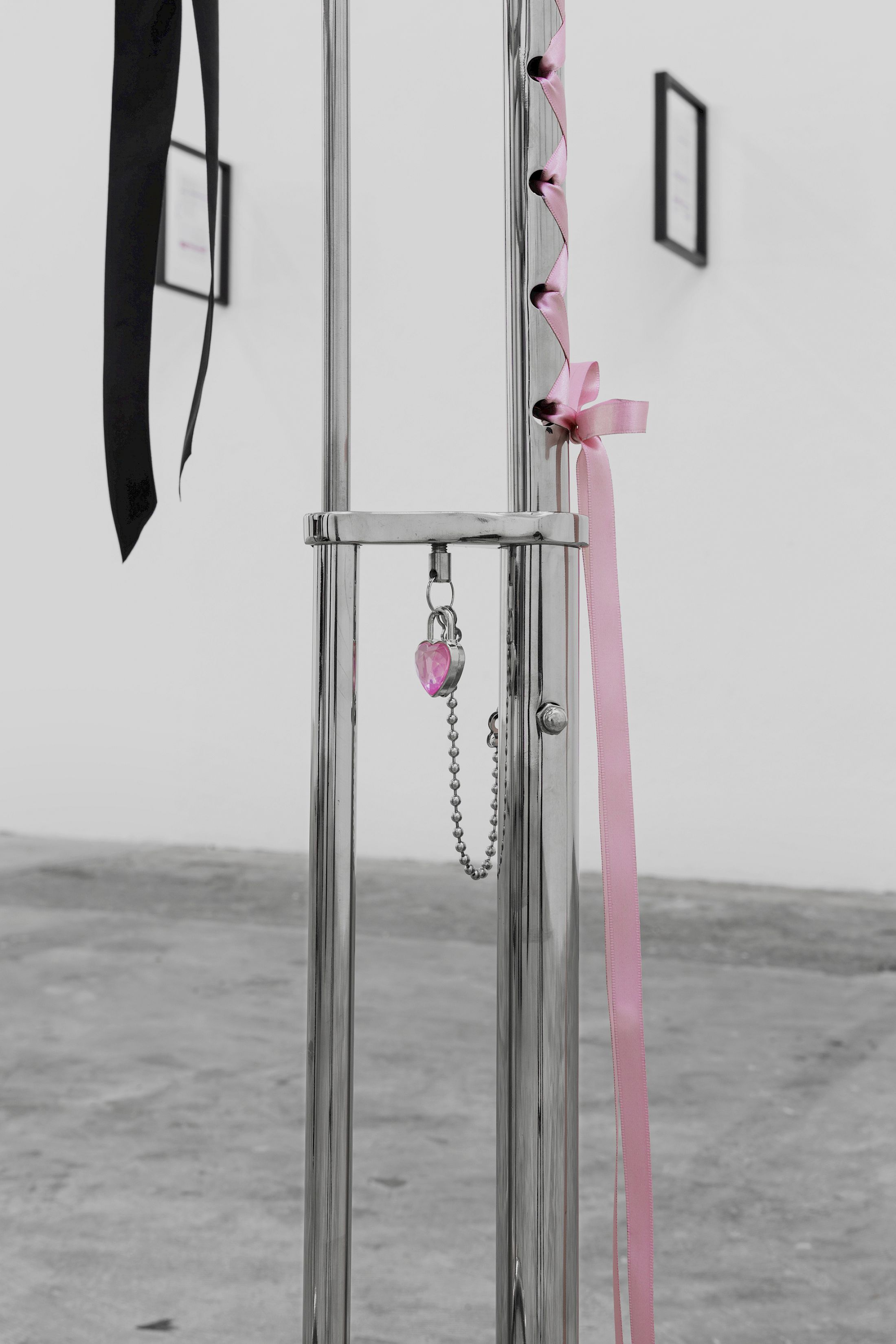 Exhibition View Solo Show Lauryn Youden «I wanna hold the hand inside you ; view on Hey Nana, if you and I were lovers, would we have been able to fill the emptiness by holding each other?(Detail), 2025, 2x E-1027 Adjustable Tables (1927), black ribbons, pink ribbons, glass engravings of Utena Revolutionary Girl kiss, red oil paint, 96.5 × 95 × 56 cm» at CIRCUIT, Lausanne, 2025 / Photo: Aude Mayer / Courtesy: the artist and CIRCUIT