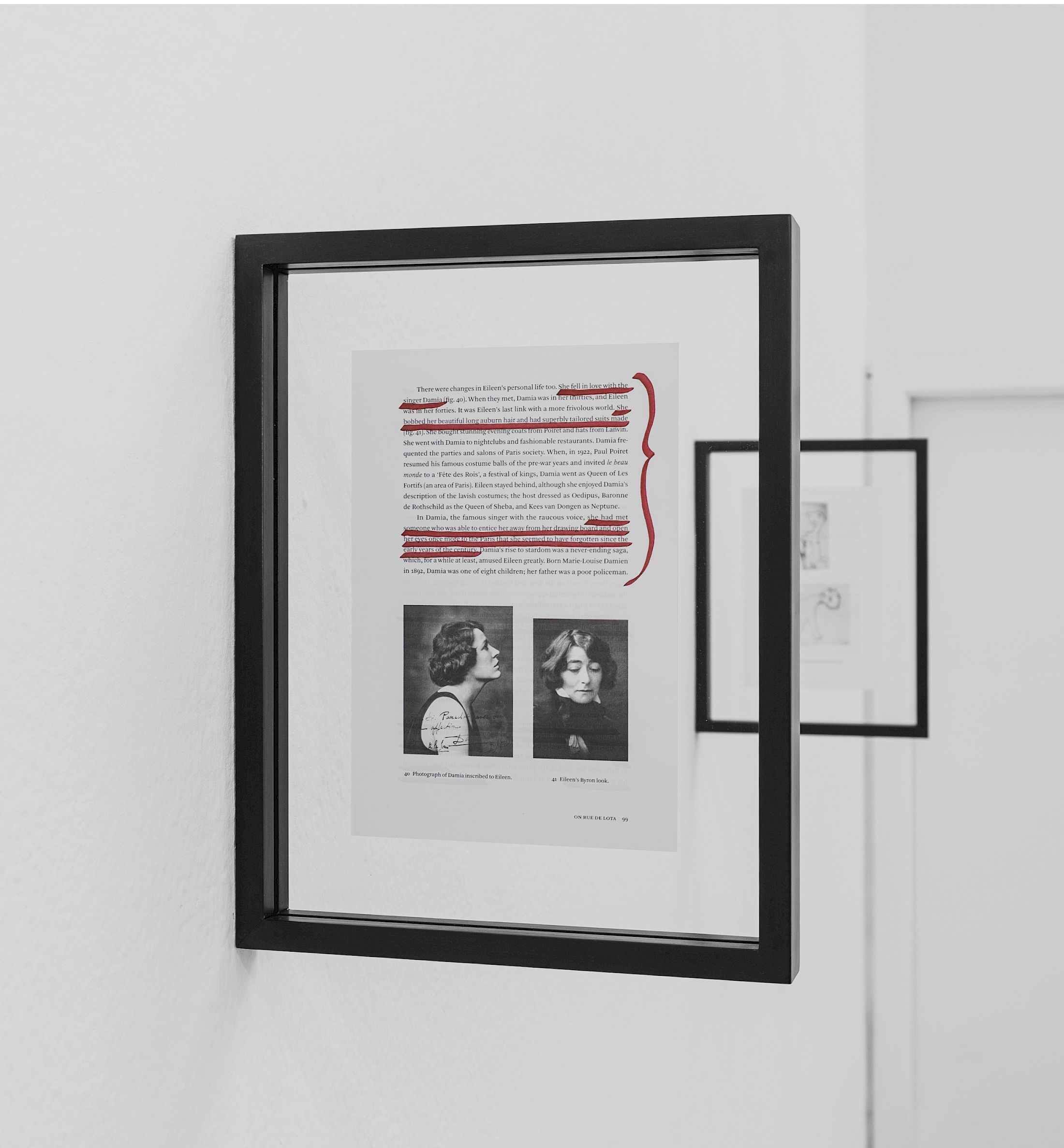 Exhibition View Solo Show Lauryn Youden «I wanna hold the hand inside you ; view on à lire avec les trois cigarettes oubliées, 2025, series of 12 pages from Peter Adam’s Eileen Gray: Her Life and Work, red ink, charcoal stained frames, 35 × 27.5 × 3 cm (each), dimensions variable (all 12x)» at CIRCUIT, Lausanne, 2025 / Photo: Aude Mayer / Courtesy: the artist and CIRCUIT