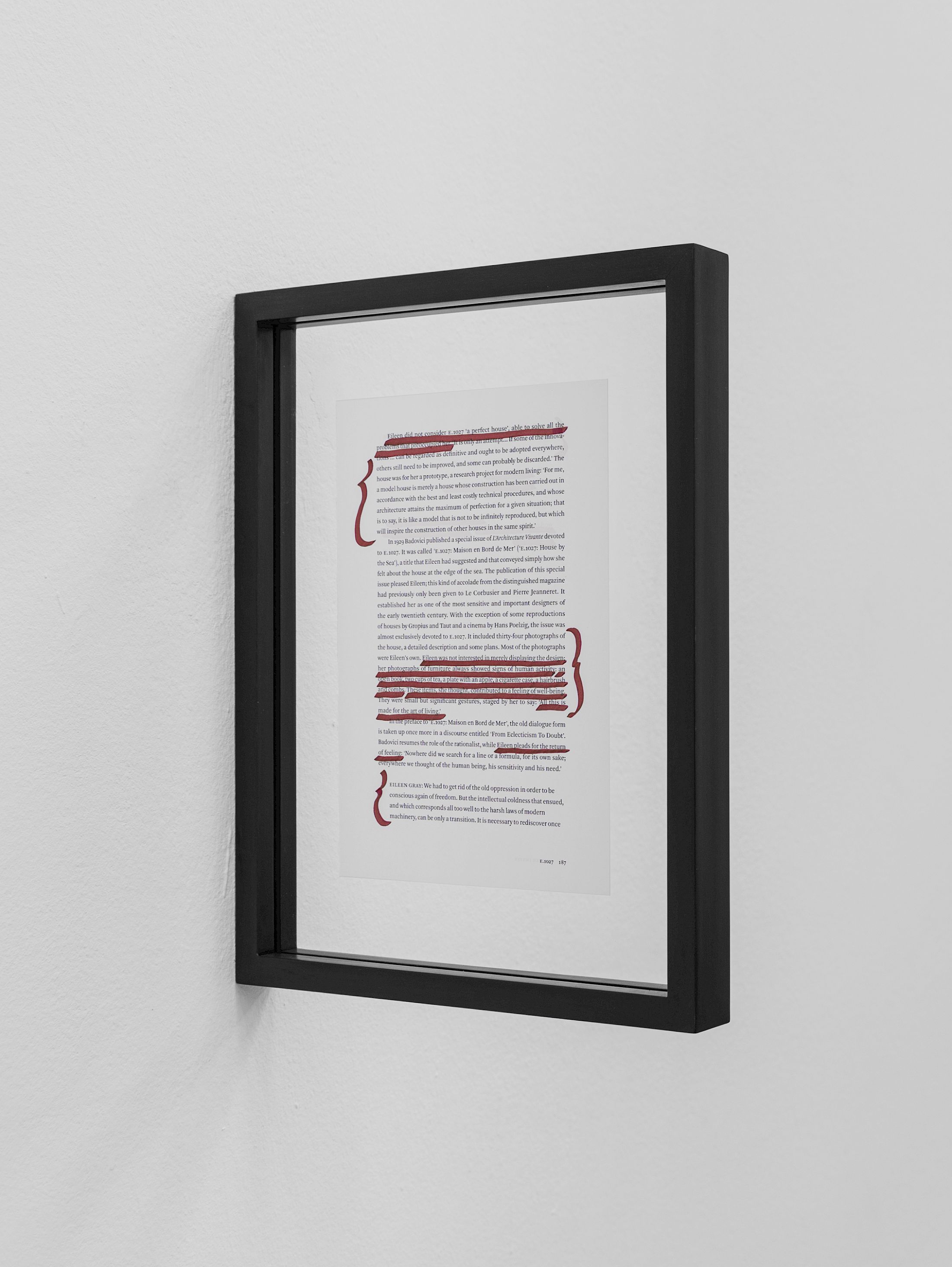 Exhibition View Solo Show Lauryn Youden «I wanna hold the hand inside you ; view on à lire avec les trois cigarettes oubliées, 2025, series of 12 pages from Peter Adam’s Eileen Gray: Her Life and Work, red ink, charcoal stained frames, 35 × 27.5 × 3 cm (each), dimensions variable (all 12x)» at CIRCUIT, Lausanne, 2025 / Photo: Aude Mayer / Courtesy: the artist and CIRCUIT