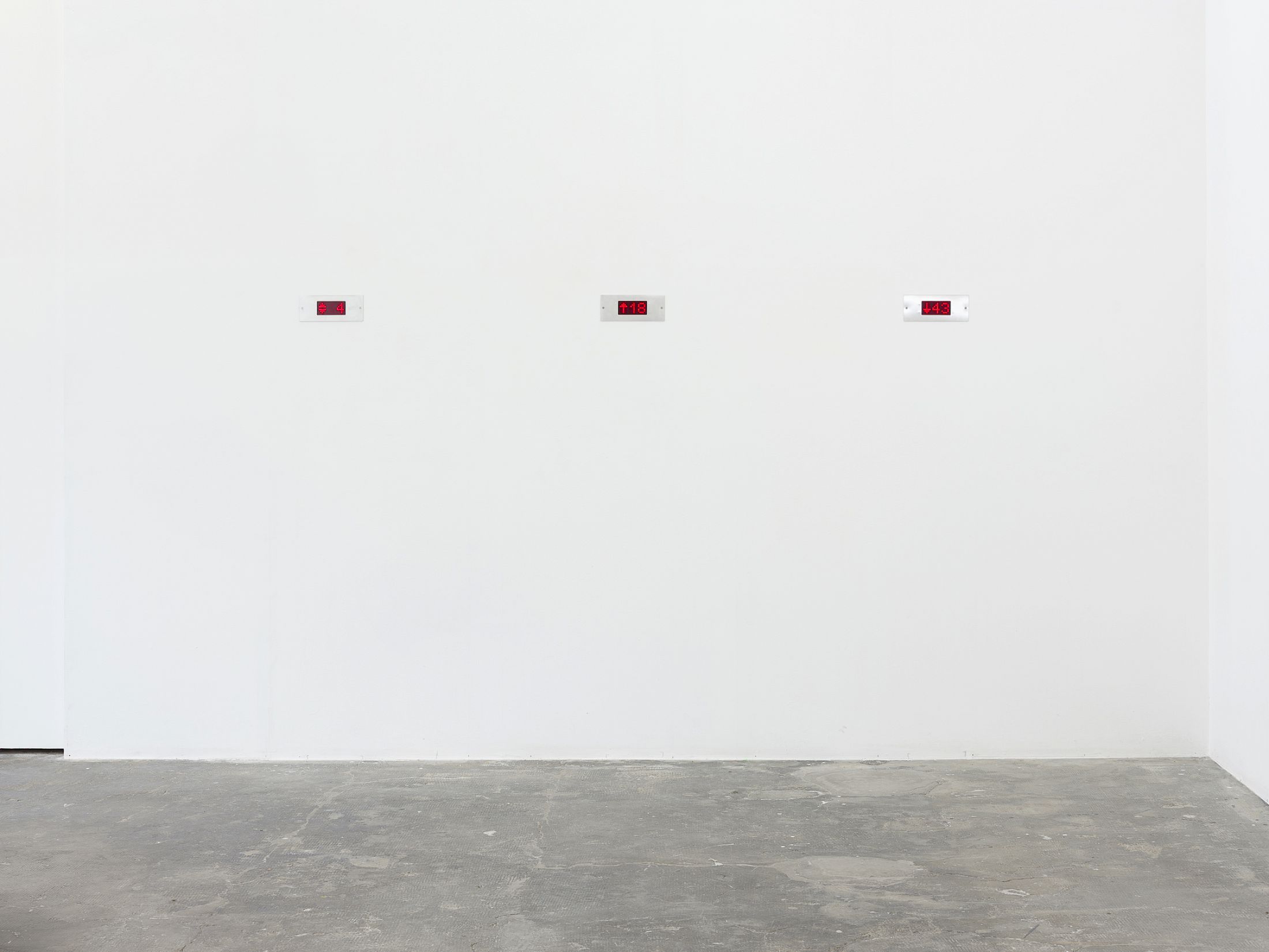 Exhibition View Group Show «Long distance relationship ; view on Gabriele Garavaglia, Dial (4), 2023, active dial, logic module, video, 22 × 9cm ; Dial (All The Way Up), 2023, active dial, logic module, video, 22 × 9cm ; Dial (All The Way Down), 2023, active dial, logic module, video, 22 × 9cm» at Smallville, Neuchâtel, 2025 / Photo: Sebastien Verdon / Courtesy: the artists and Smallville