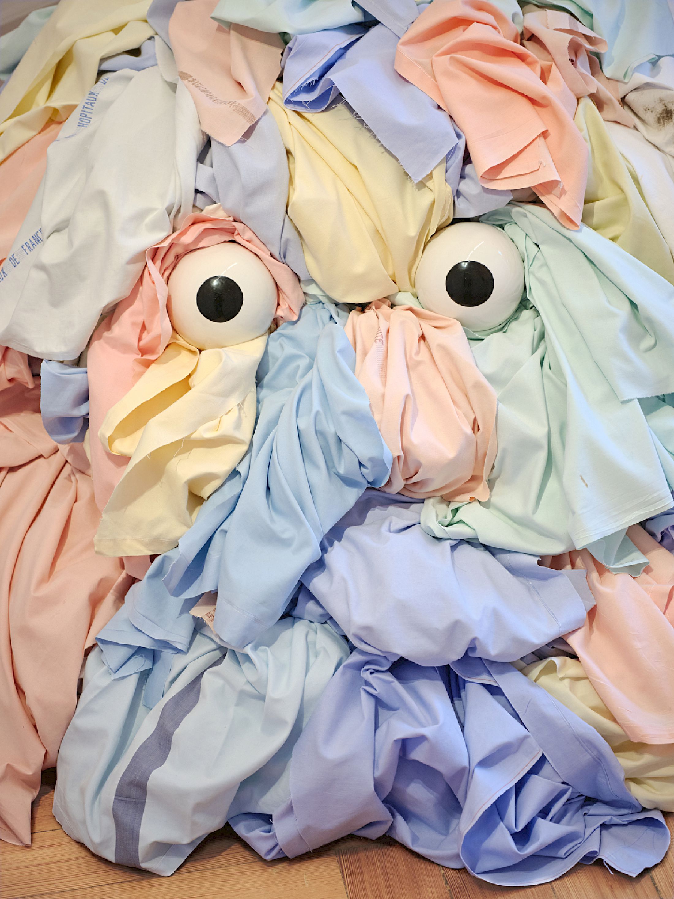 Exhibition View Group Show «Stitches: A Haunted House and Other Ghost Stories ; view on Benoît Piéron, Cairn, 2024, discarded hospital sheets, porcelain» at Villa Bernasconi, Lancy, Geneva, 2026 / Photo: Nicolas Delaroche / Courtesy: the artist and Galerie Sultana