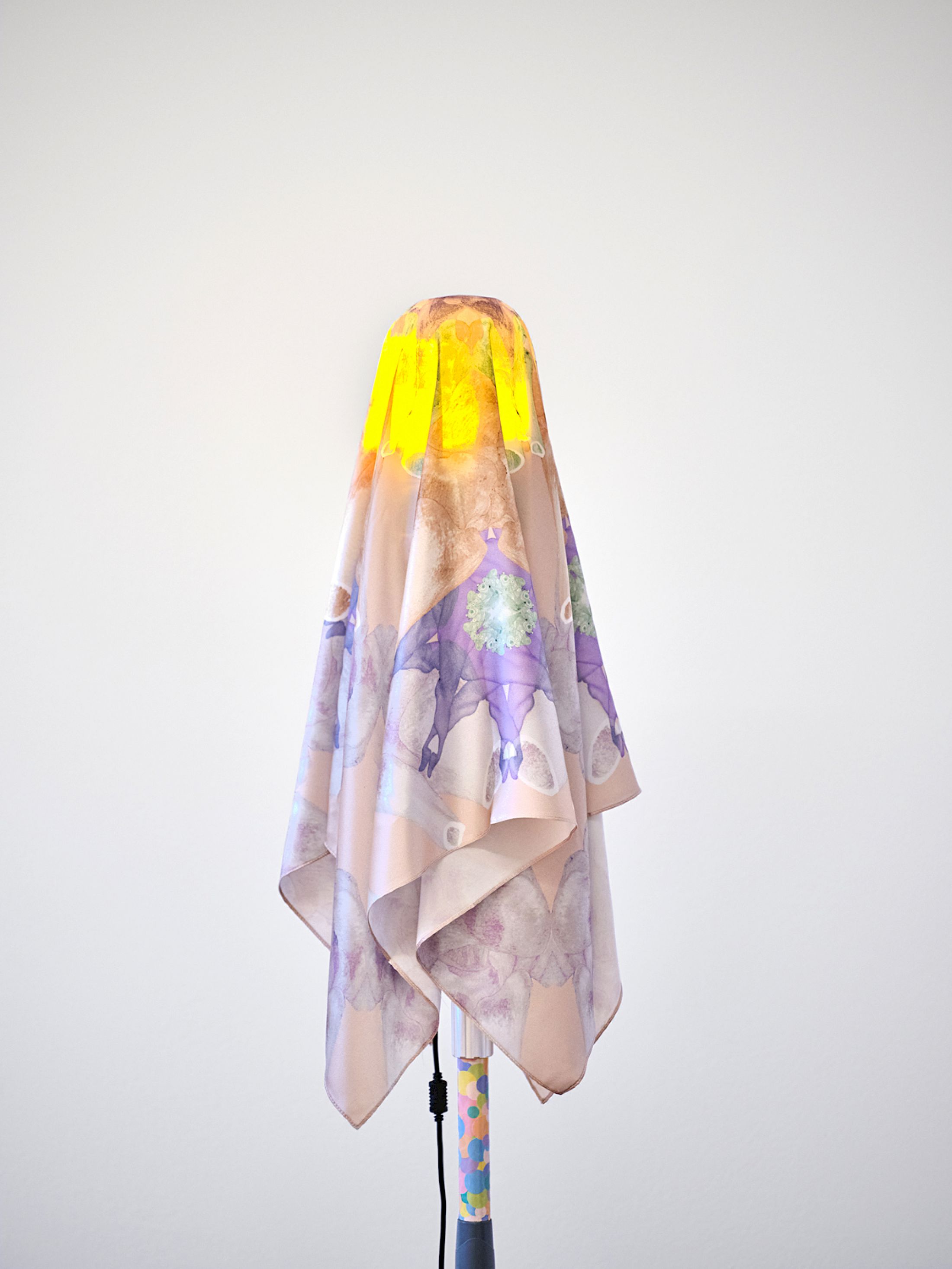 Exhibition View Group Show «Stitches: A Haunted House and Other Ghost Stories ; view on Lucie II (lampadaire), 2024, IV pole, adhesive pads, rotating beacon, silk scarf (by Sarah Schrader)» at Villa Bernasconi, Lancy, Geneva, 2026 / Photo: Nicolas Delaroche / Courtesy: the artist and Galerie Sultana