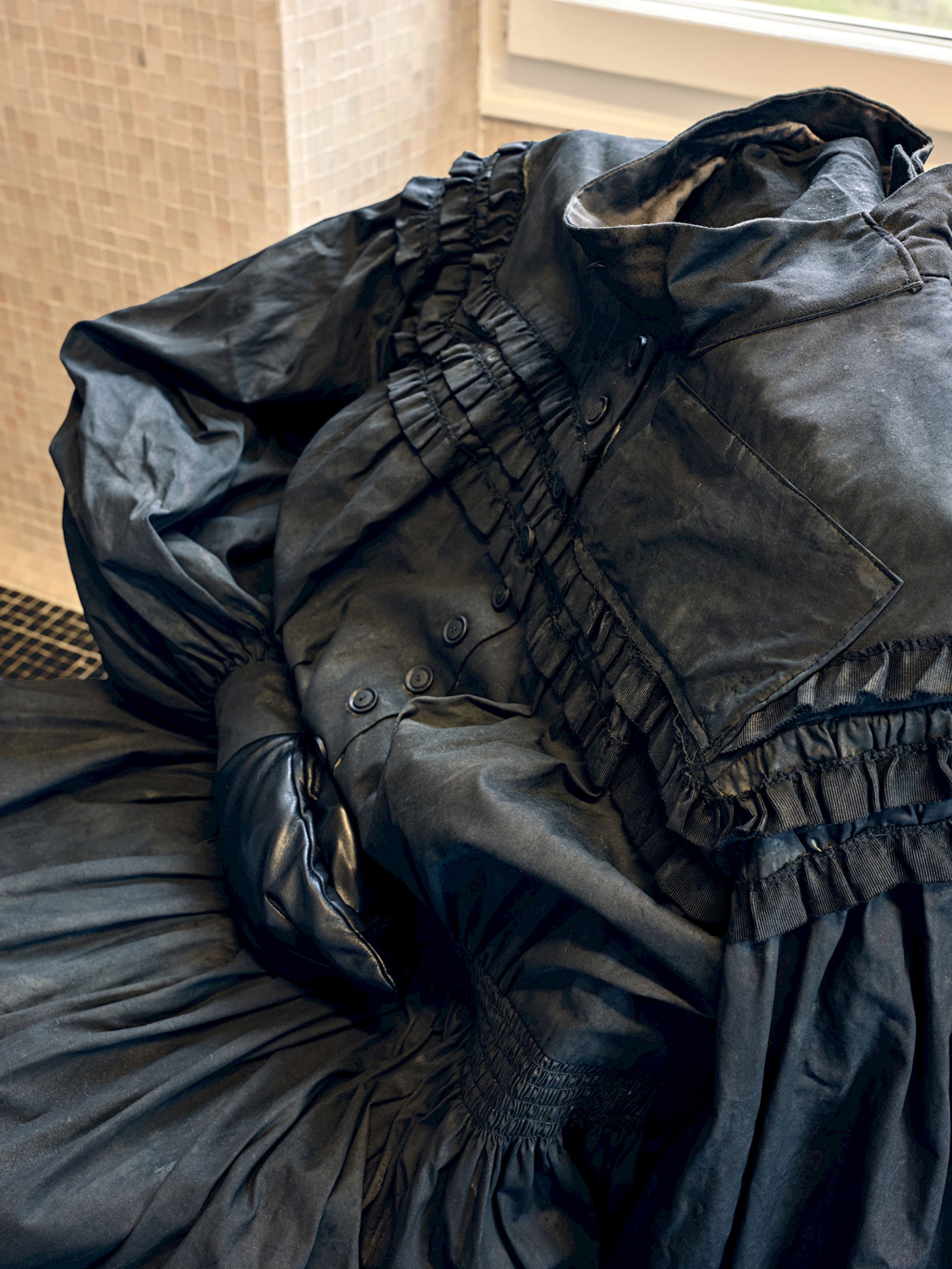 Exhibition View Group Show «Stitches: A Haunted House and Other Ghost Stories ; view on Gregory Tara Hari, House of Endless Corridors, 2025, mixed fabrics, dye, leather, smartphone, costume by Lena Schmid» at Villa Bernasconi, Lancy, Geneva, 2026 / Photo: Nicolas Delaroche / Courtesy: the artists and Villa Bernasconi