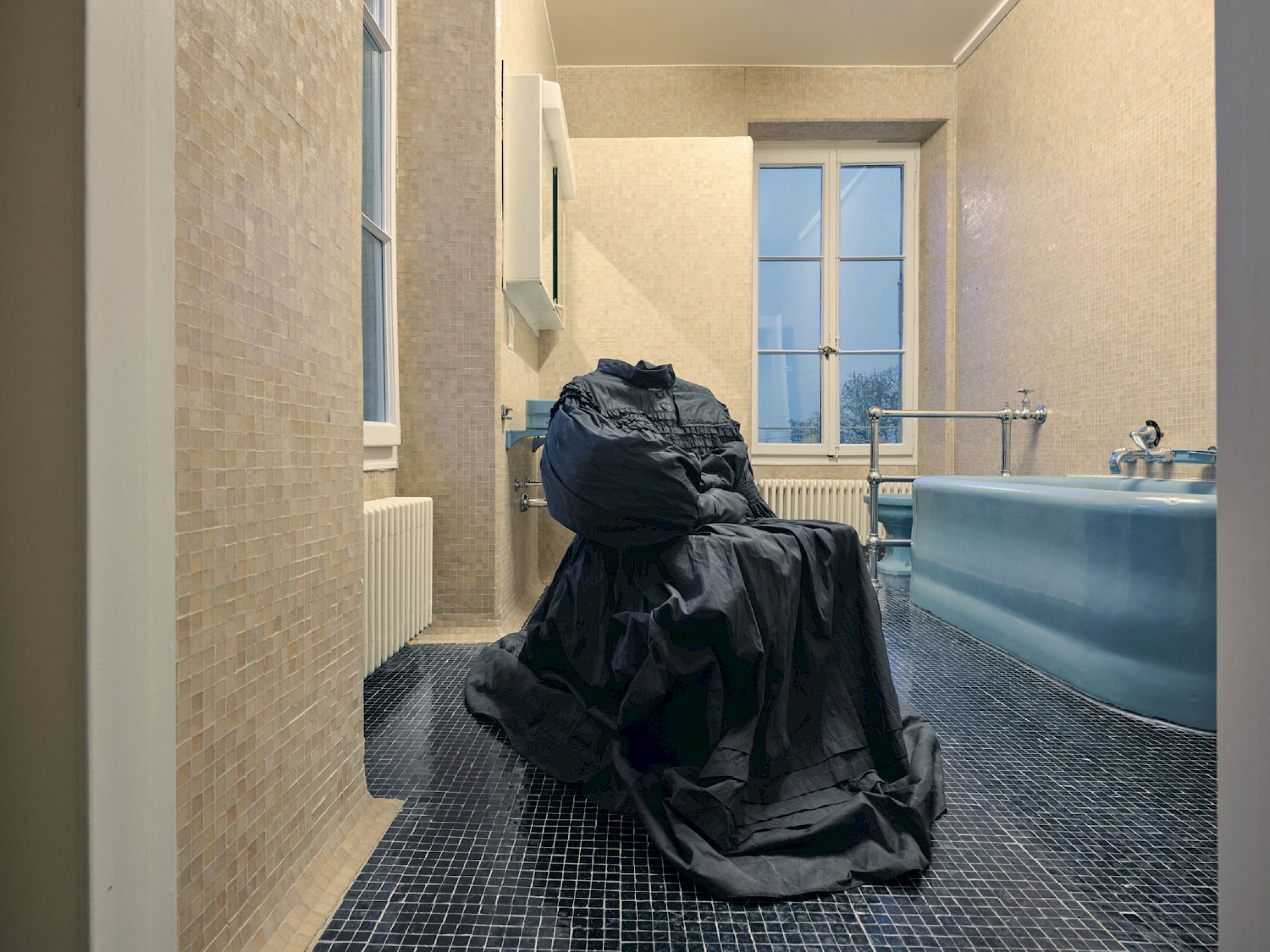 Exhibition View Group Show «Stitches: A Haunted House and Other Ghost Stories ; view on Gregory Tara Hari, House of Endless Corridors, 2025, mixed fabrics, dye, leather, smartphone, costume by Lena Schmid» at Villa Bernasconi, Lancy, Geneva, 2026 / Photo: Nicolas Delaroche / Courtesy: the artists and Villa Bernasconi