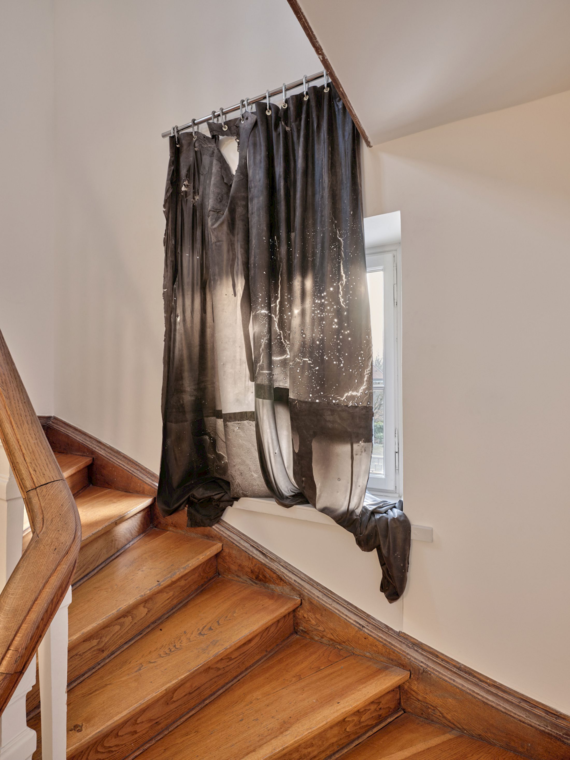 Exhibition View Group Show «Stitches: A Haunted House and Other Ghost Stories ; view on Li Tavor, Dark Curtains I, II, III, 2025, pigmented latex curtains, aluminum, carabiners» at Villa Bernasconi, Lancy, Geneva, 2026 / Photo: Nicolas Delaroche / Courtesy: the artists and Villa Bernasconi