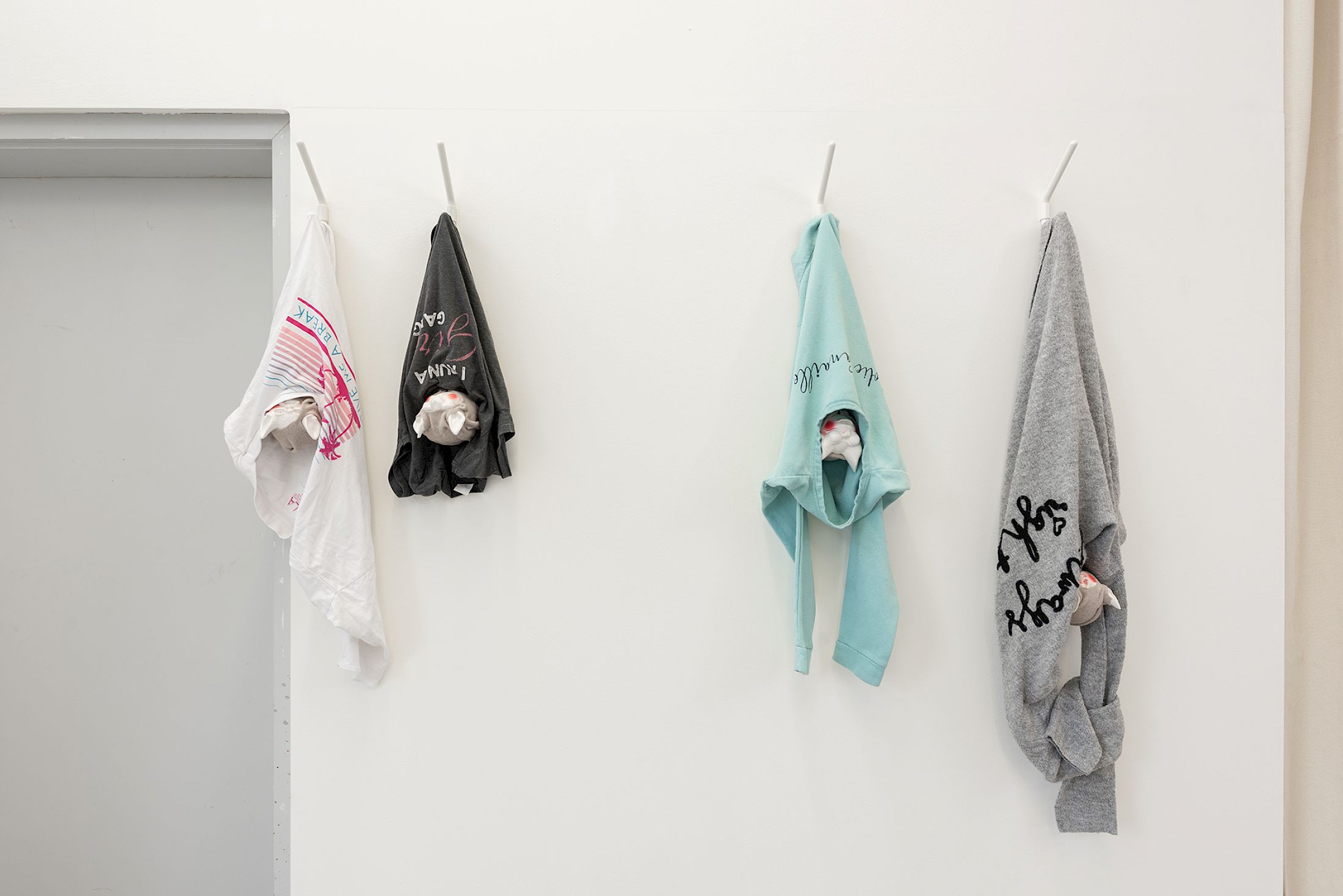 Exhibition View Group Show «Stocker comme des objets ; view on Virginie Sistek, ivre ensemble, 2026, T- shirt, coat rack, varnished Plasticrete acrylic resin, polystyrene, cotton fleece, wool, variable dimensions» at Widefield, Geneva, 2026 / Photo: Remy Ugarte Vallejos / Courtesy: the artists and Widefield