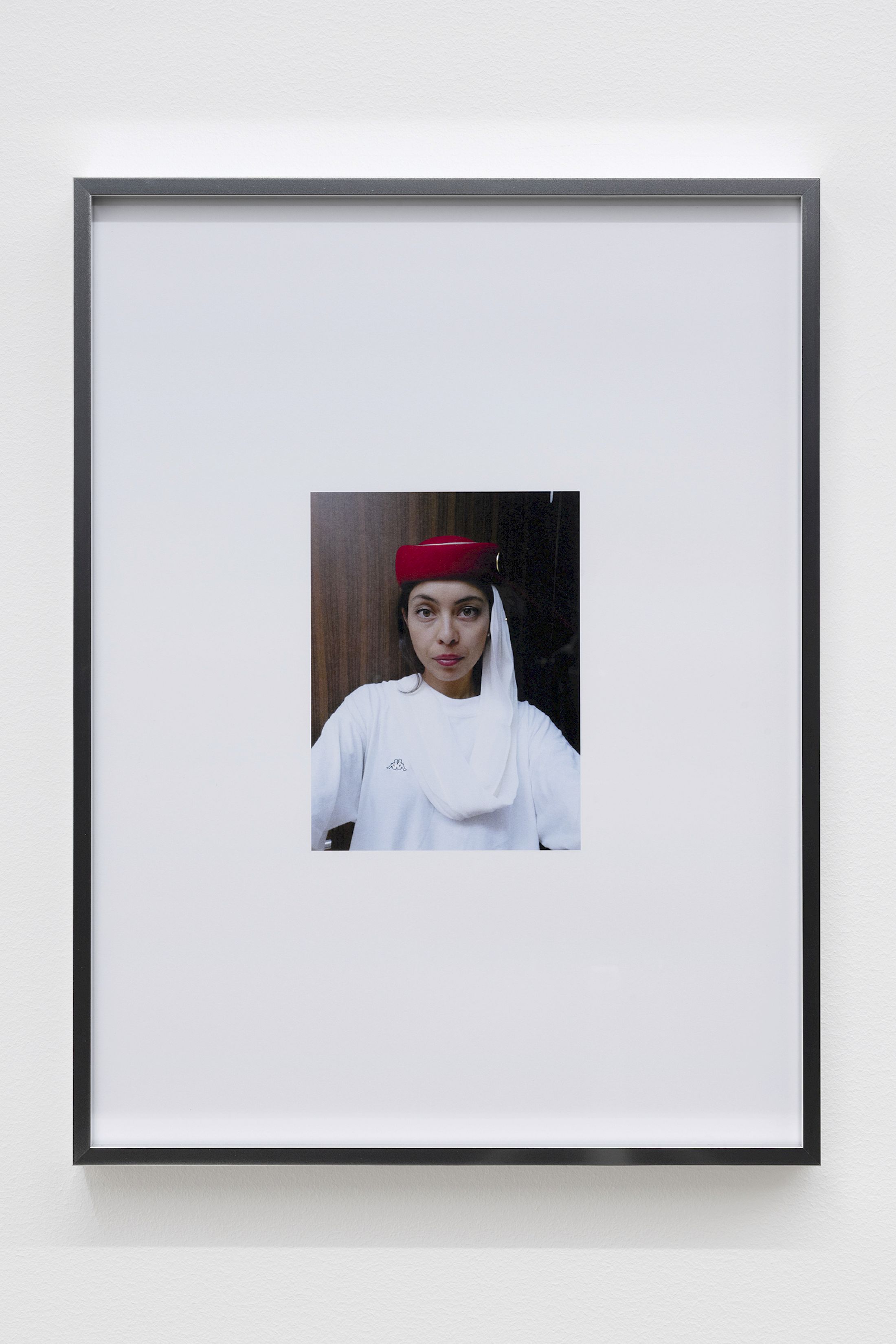 Exhibition View Group Show «Wear a mask and your face grows to fit it ; view on Mati Jhurry, duty free_Emirates Staff No.460596, 2025, Series of 9 photographs pulled from the archive of performance Emirates Staff no. 460596, digital print on paper, aluminium frame, 31 × 41 × 2 cm each» at For, Basel, 2025 / Photo: Gina Folly / Courtesy: the artists and For