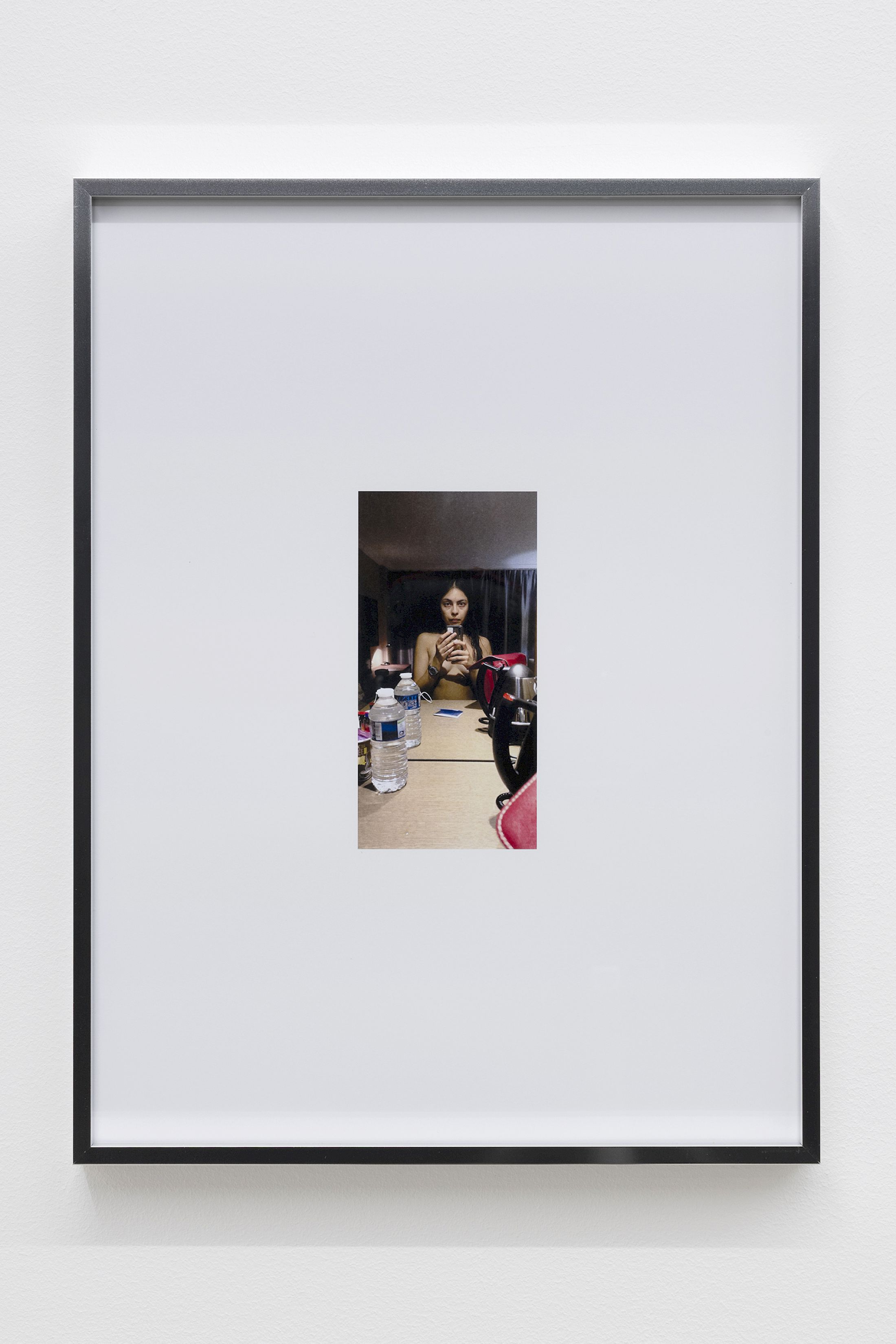 Exhibition View Group Show «Wear a mask and your face grows to fit it ; view on Mati Jhurry, duty free_Emirates Staff No.460596, 2025, Series of 9 photographs pulled from the archive of performance Emirates Staff no. 460596, digital print on paper, aluminium frame, 31 × 41 × 2 cm each» at For, Basel, 2025 / Photo: Gina Folly / Courtesy: the artists and For