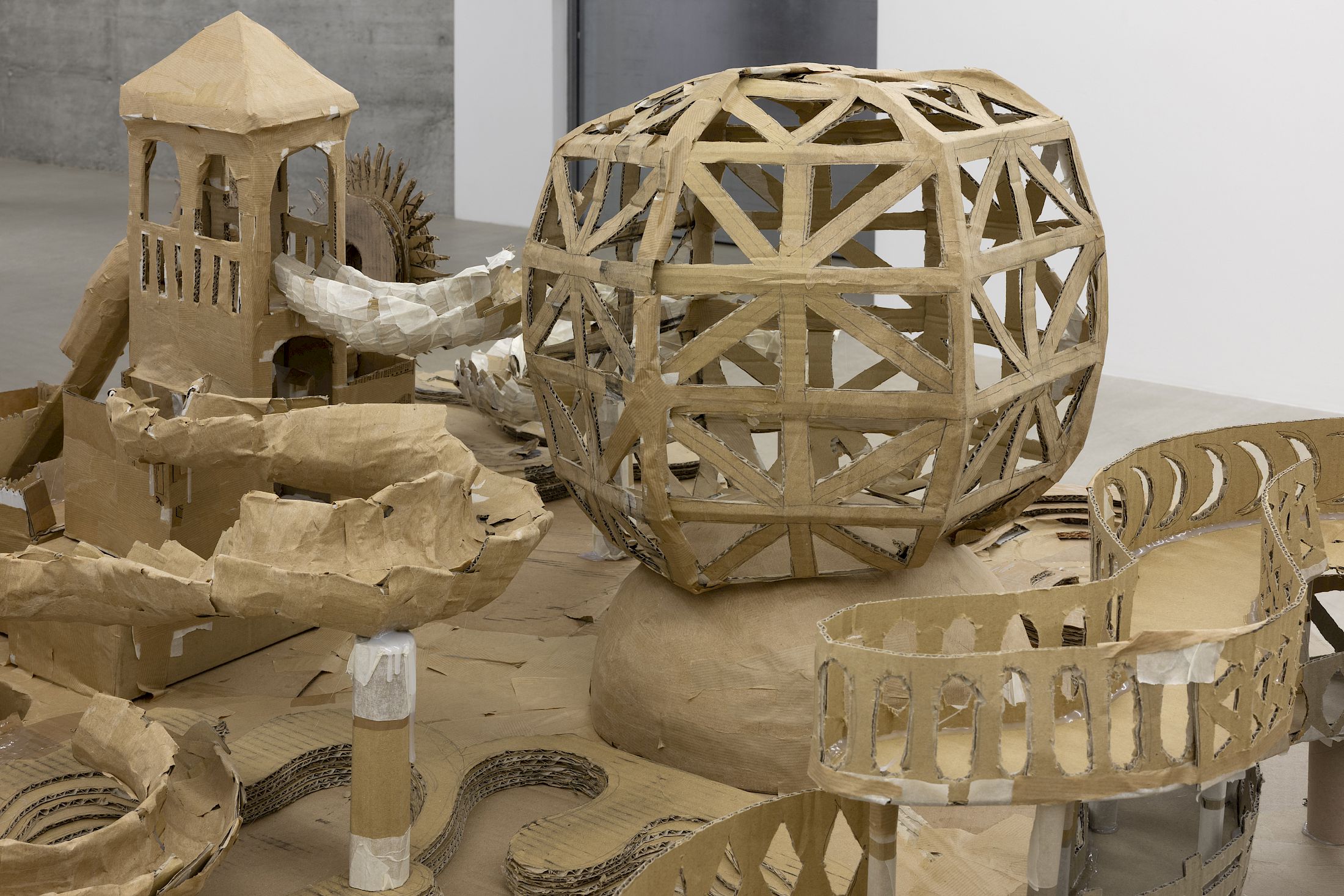 Exhibition View Group Show «Wear a mask and your face grows to fit it ; view on Sebastián Dávila, Modelo para una isla (Detail), 2025, cardboard, 250 × 130 × 100 cm» at For, Basel, 2025 / Photo: Gina Folly / Courtesy: the artists and For