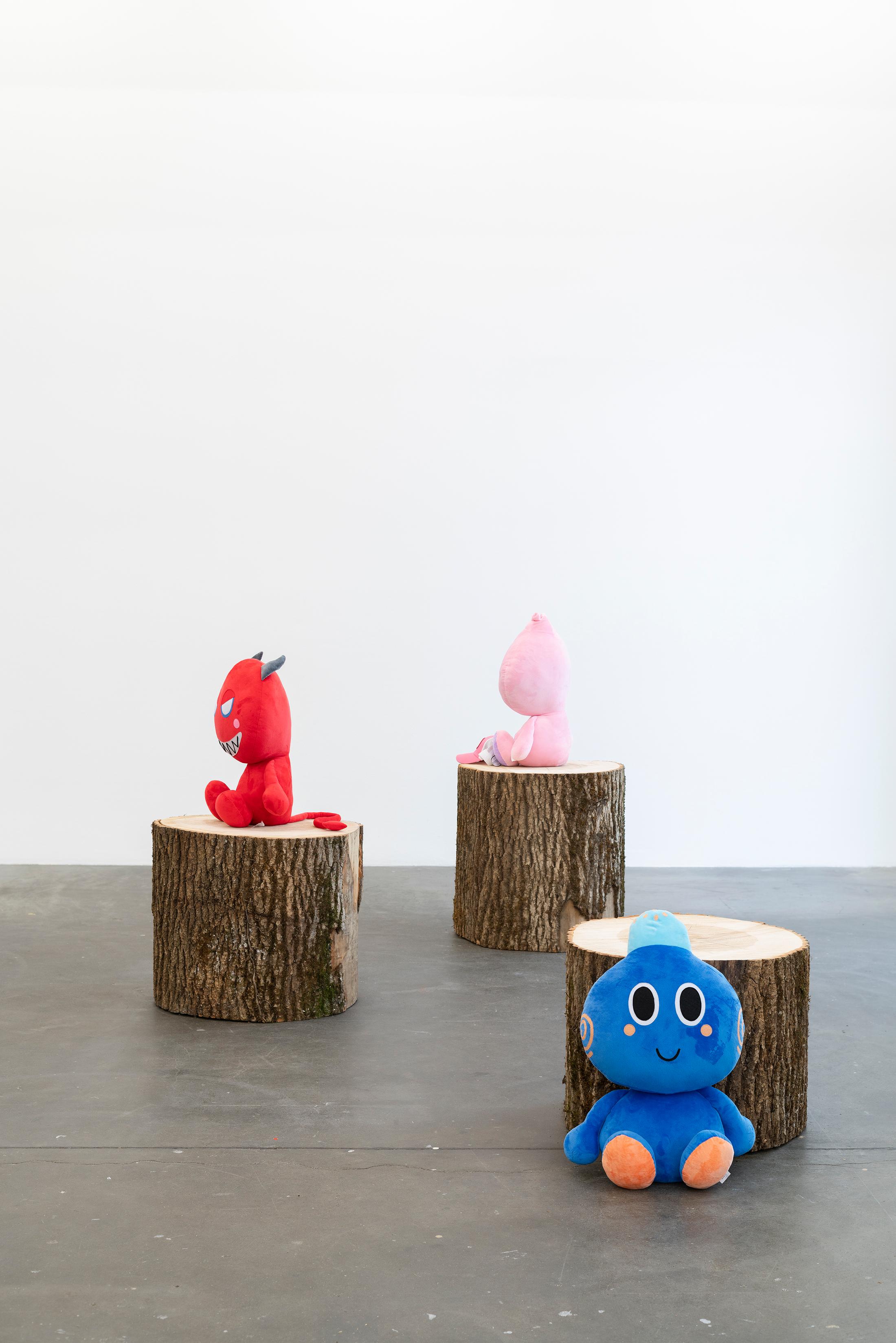 Exhibition View Group Show «ALL I EAT IN A DAY; view on Sanko GameCorp ©, Based Bun (pink), Geeny (blue), DEV (red), 2024» at Kunst Halle Sankt Gallen, Sankt Gallen, 2024 / Photo: E. Sommer / Courtesy: Sanko GameCorp ©