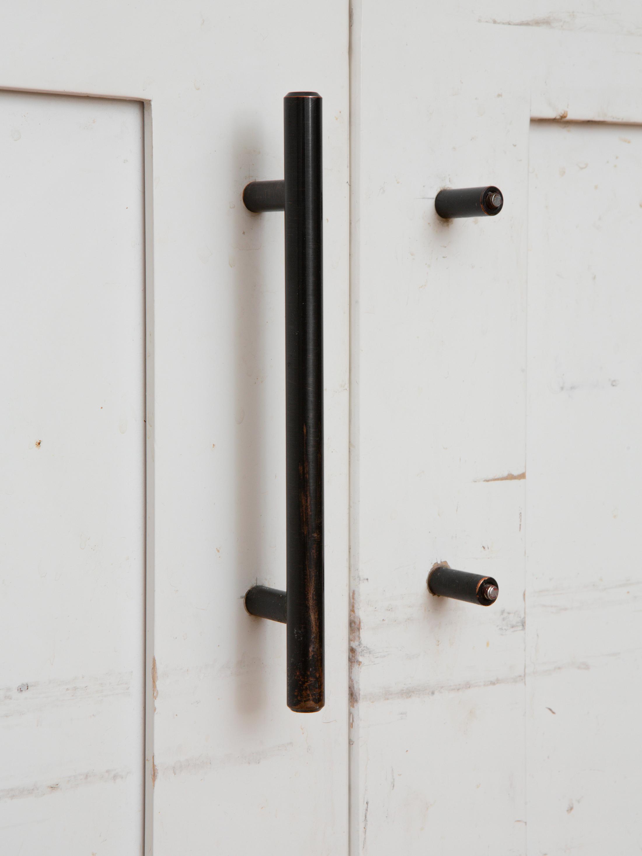 Exhibition View Emily Barker Solo Show «Wall Works; view on Emily Barker, Kitchen cabinet doors (under the sink), 2023, Wood, paint, plastic and metal, 56 x 126 x 2 cm» at Sentiment, Zurich, 2023-2024 / Photo: Philipp Rupp & Julien Gremaud / Courtesy: the artist and Sentiment