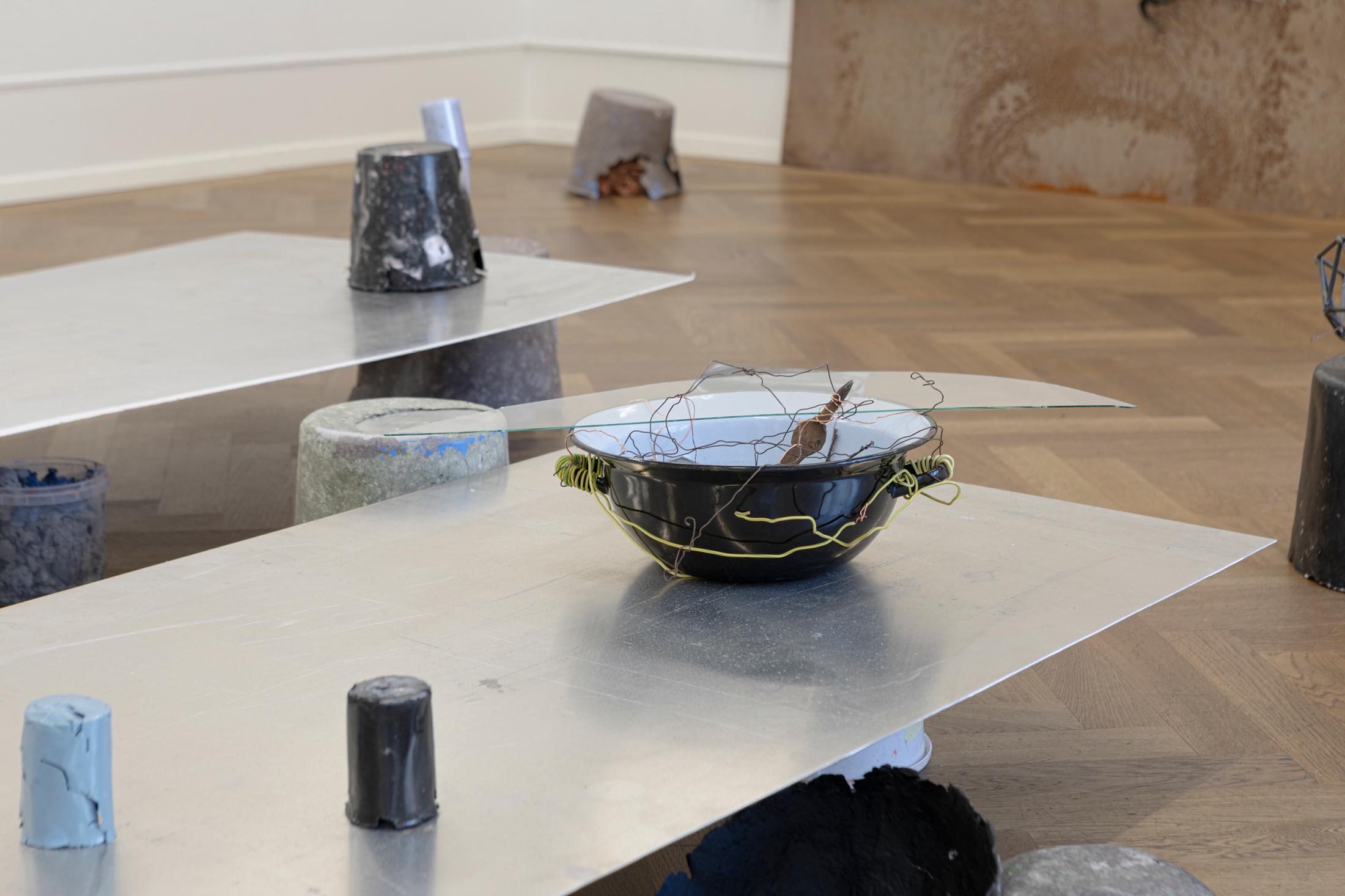 Exhibition View Solo Show Julia Znoj «BASS MY TRESPASS ; view on Setup (Direct Current) (detail), 2025, laboratory power supply, zinc electrolyte, water, paint, steel, aluminum, paper, glue, glass, wire, found objects, size variable» at Krone Couronne, Biel/Bienne, 2025 / Photo: Michal Schorro / Courtesy: the artist and Krone Couronne