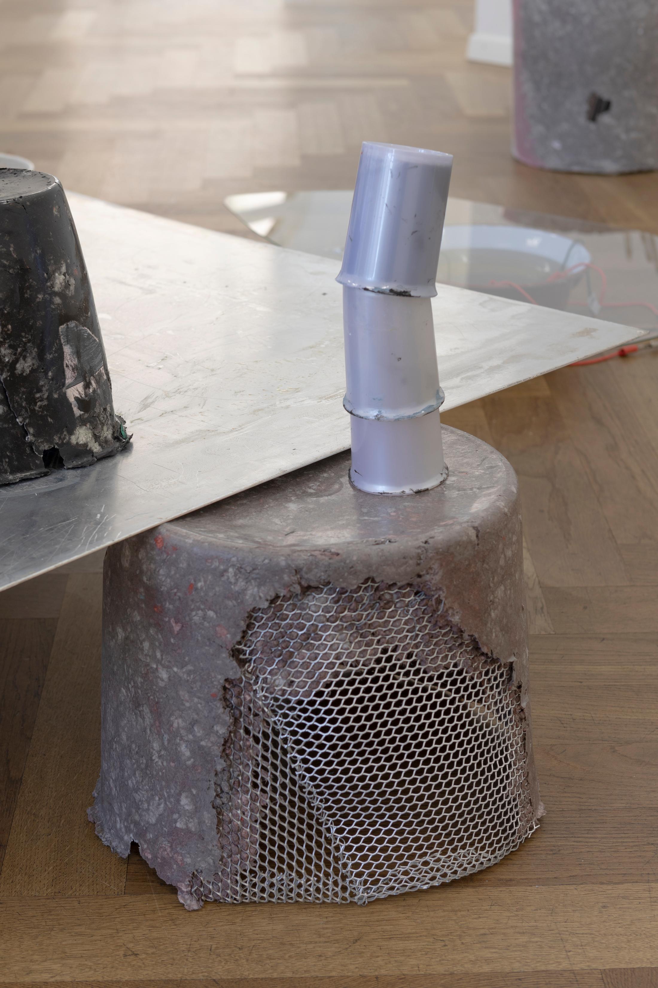 Exhibition View Solo Show Julia Znoj «BASS MY TRESPASS ; view on Setup (Direct Current) (detail), 2025, laboratory power supply, zinc electrolyte, water, paint, steel, aluminum, paper, glue, glass, wire, found objects, size variable» at Krone Couronne, Biel/Bienne, 2025 / Photo: Michal Schorro / Courtesy: the artist and Krone Couronne