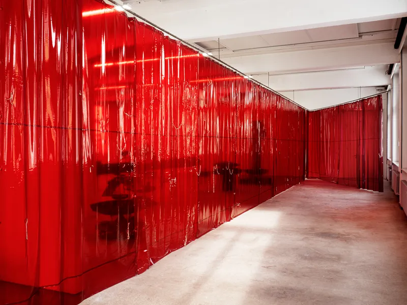 Exhibition View Double Show Martin Andereggen «Self Storage ; view on Untitled (The long lasting cult of the eccentric),  PVC protective curtains, neodym magnets, printed image,  24 × 3 m, 2024» and Martin Spühler «Kosmos» at Kunstraum Kreuzlingen, Kreuzlingen, 2024-2025 / Photo: Martin Andereggen / Courtesy: the artists and Kunstraum Kreuzlingen