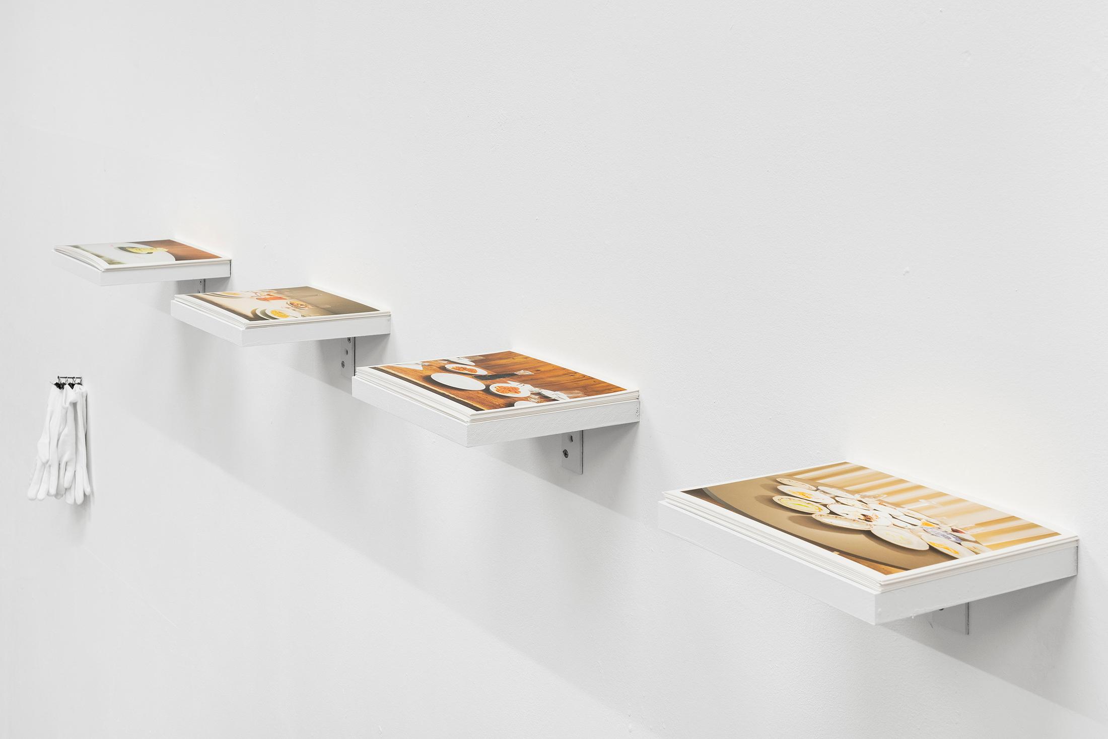Exhibition View Group Show «Gulp; view on Jacopo Valentini, From the series Paesaggi da Tavola (Trattoria Due Platani - Trattoria Entrà - Osteria di Medicina - Da Lucio Trattoria), 2023, Inkjet print, wood and cotton gloves, 20 x 220 cm» at La Rada, Locarno, 2023 / Photo: Riccardo Giancola / Courtesy: the artist and La Rada