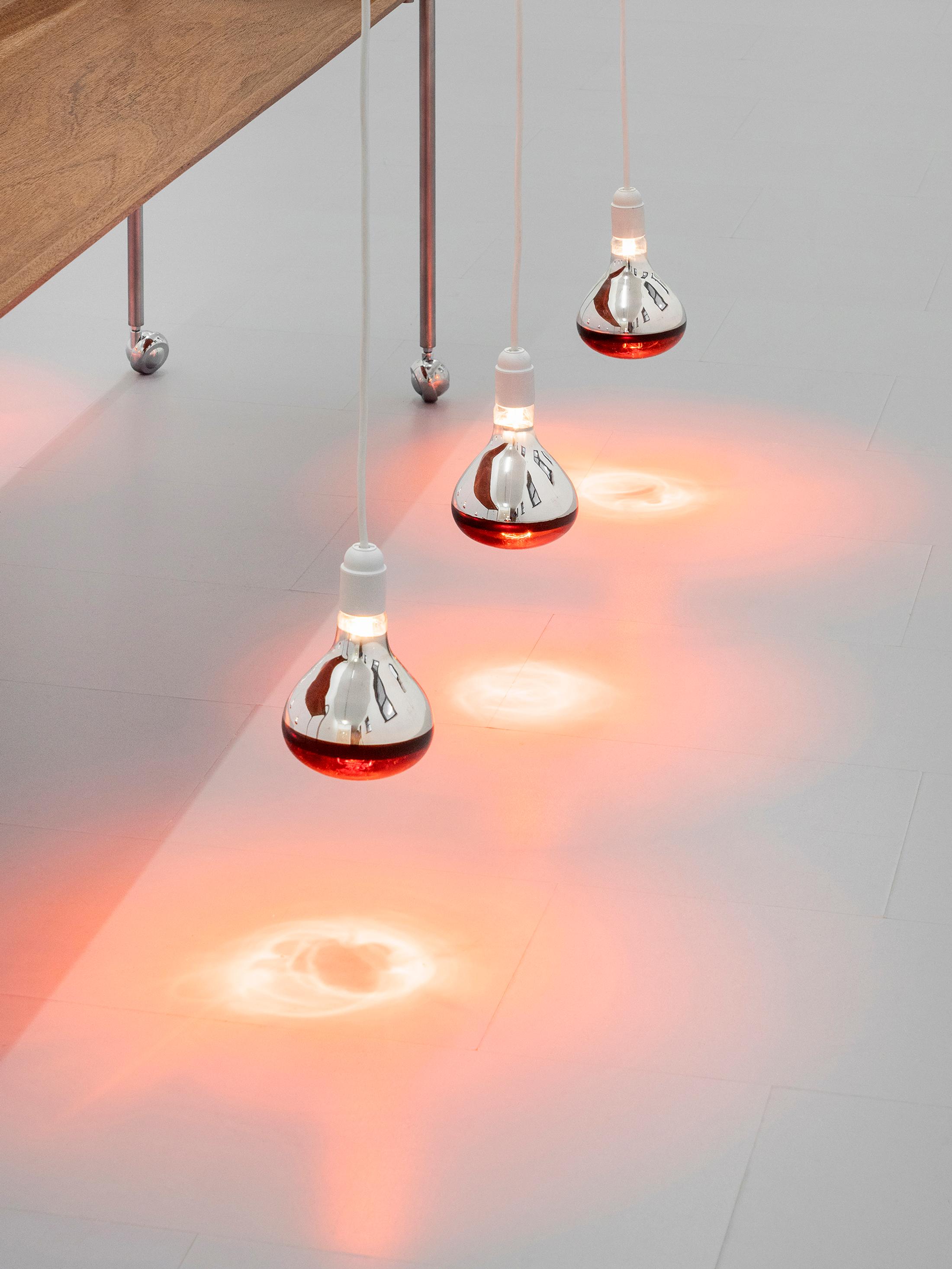 Exhibition View Group Show «Gulp; view on Clara Roumégoux, What the fire sees, 2023, Wood, metal, heating lamp, 180 x 40 x 75 cm» at La Rada, Locarno, 2023 / Photo: Riccardo Giancola / Courtesy: the artist and La Rada