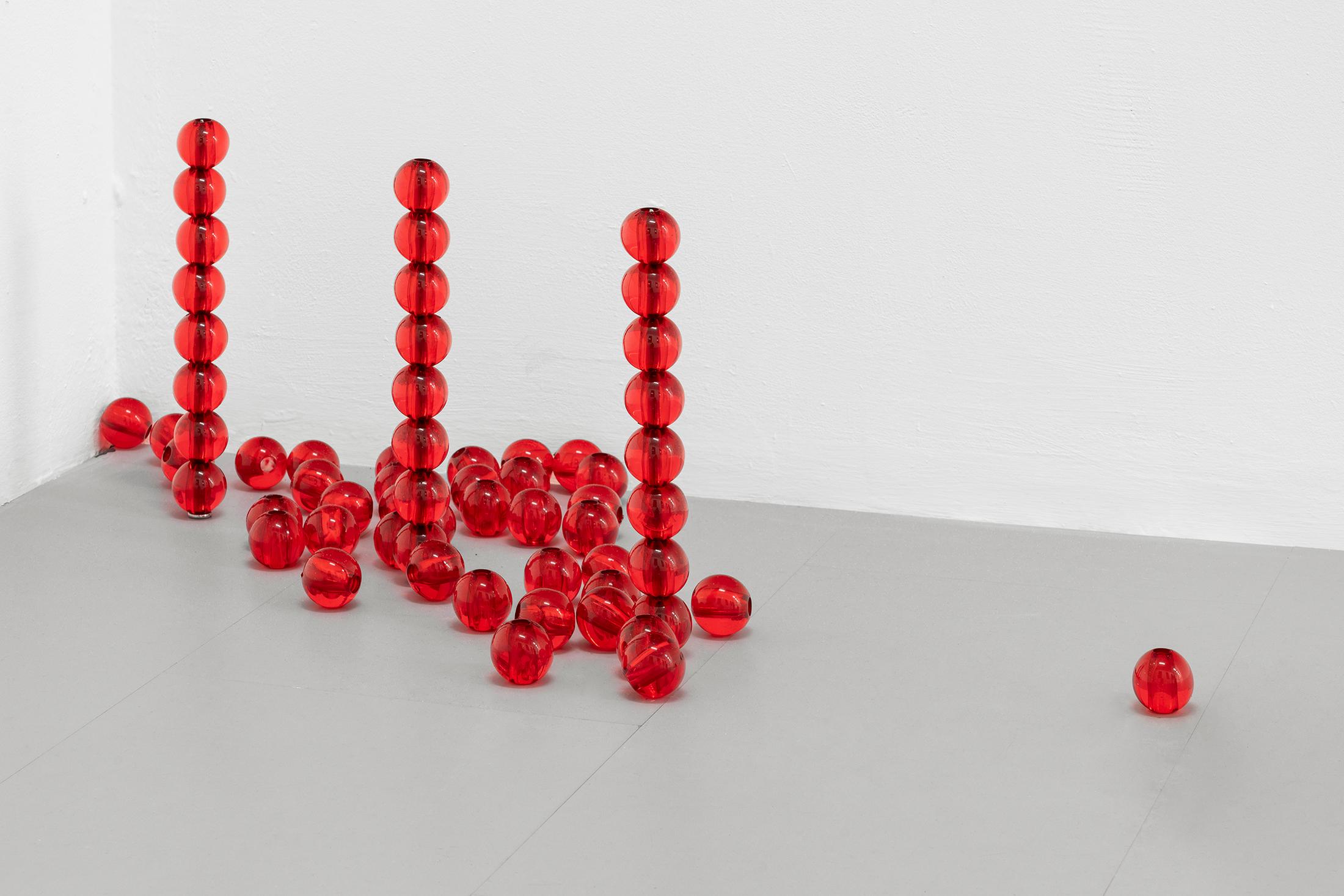 Exhibition View Group Show «Gulp; view on Clara Roumégoux, Red beads, 2023, Beads (acrylic, metal), Variable dimensions» at La Rada, Locarno, 2023 / Photo: Riccardo Giancola / Courtesy: the artist and La Rada