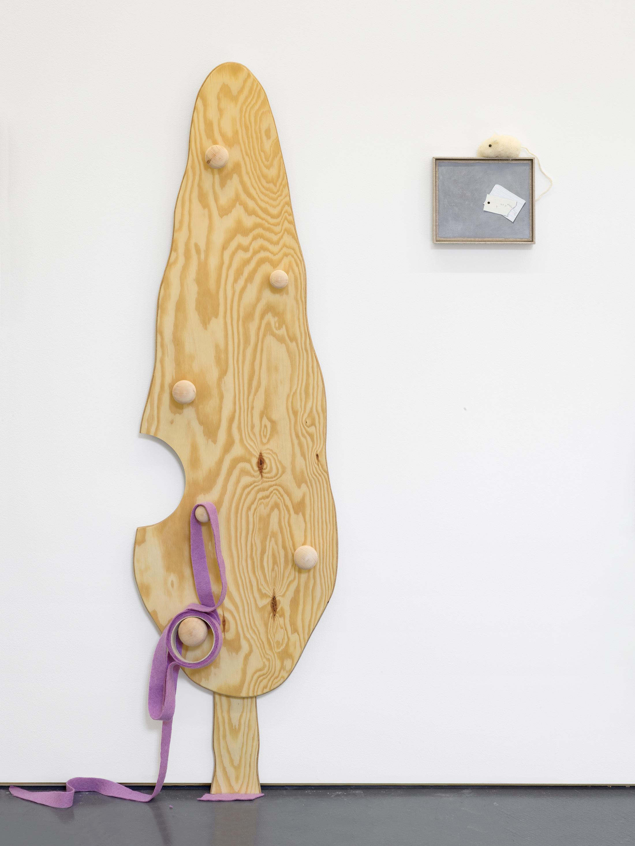 Exhibition View Solo Show Min Yoon «Perspectives + ing; view on Min Yoon, A, G + ing: Lilac Position, 2024, 2 parts: Plywood, wooden handles, wool felt; Oil on canvas, wool felt, artist’s frame, 137 x 38 x 7.5 cm; 16 x 19 x 2.5 cm» at Galerie Francesca Pia, Zurich, 2024 / Photo: Cedric Mussano / Courtesy: The artist and Galerie Francesca Pia